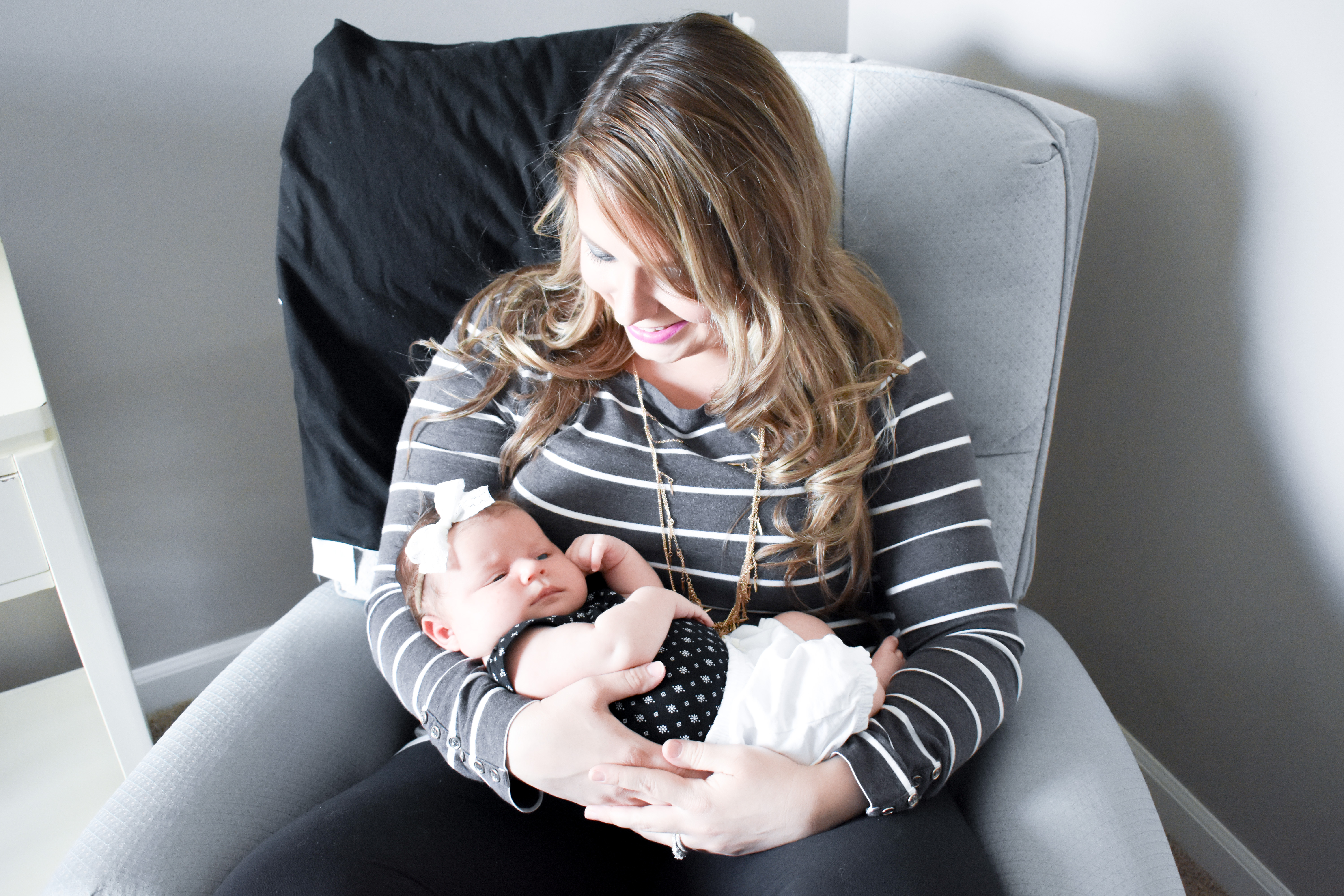 Mom and Newborn Daughter in Rocking Chair