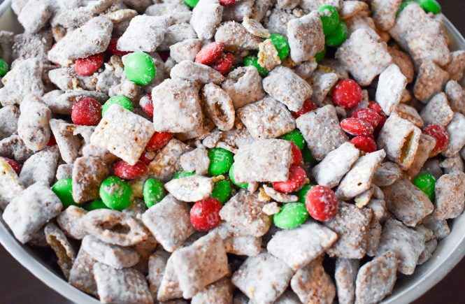 Your family will love this kid-friendly Christmas dessert recipe for Reindeer Treats! It doesn't matter whether you call it Reindeer Treats, Reindeer Chow, Christmas Muddy Buddies, or even Puppy Chow... everyone loves a big bowl of this stuff! This holiday version is even more festive with the addition of red and green candies.