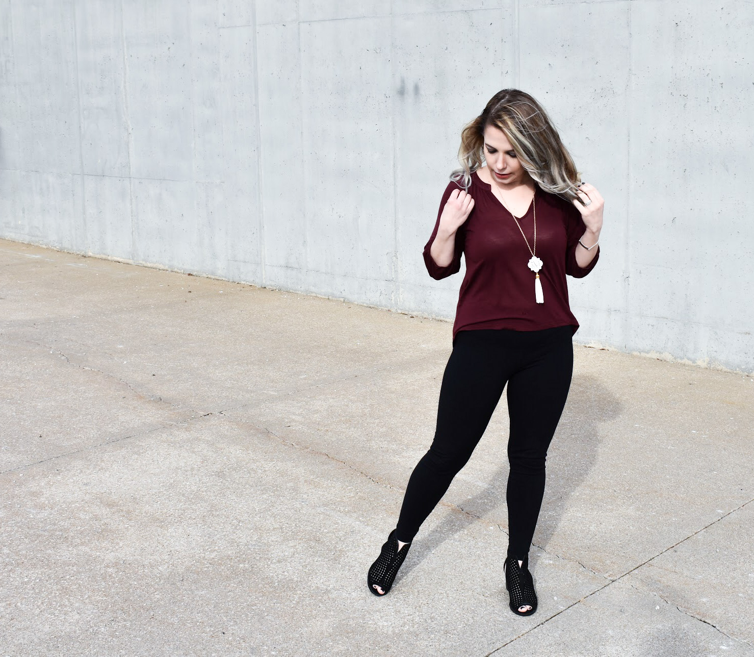 Dress Up Leggings with Ankle Boots. One of my favorite outfit ideas for leggings is to dress the leggings up with some stylish ankle boots! Take leggings from day to night with this easy styling trick! Here, I styled black leggings with black ankle boots for a sleek monochromatic look.