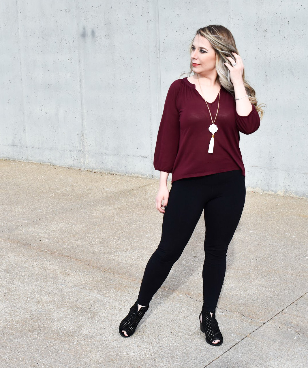 Dress Up Leggings with Ankle Boots. One of my favorite outfit ideas for leggings is to dress the leggings up with some stylish ankle boots! Take leggings from day to night with this easy styling trick! Here, I styled black leggings with black ankle boots for a sleek monochromatic look.