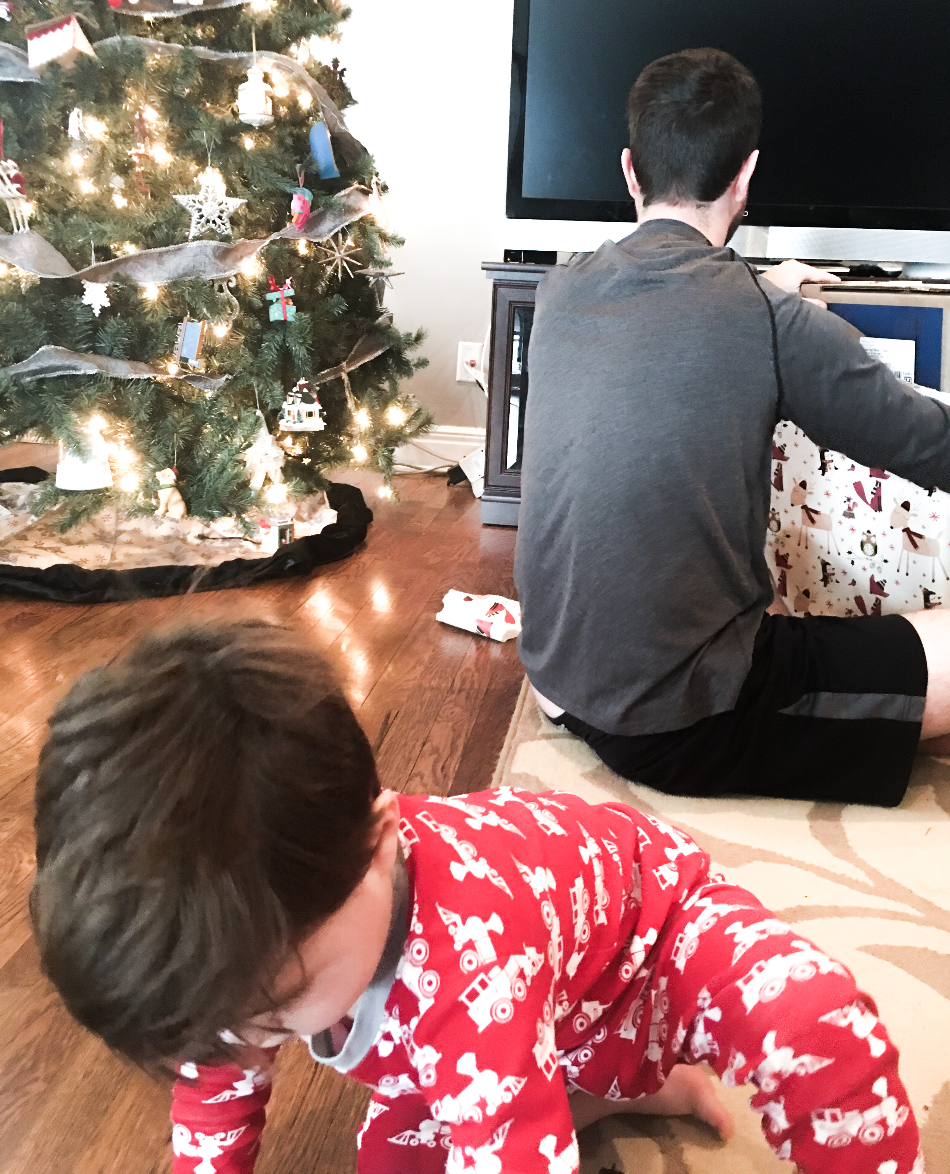 Dad and Son Opening Christmas Gifts