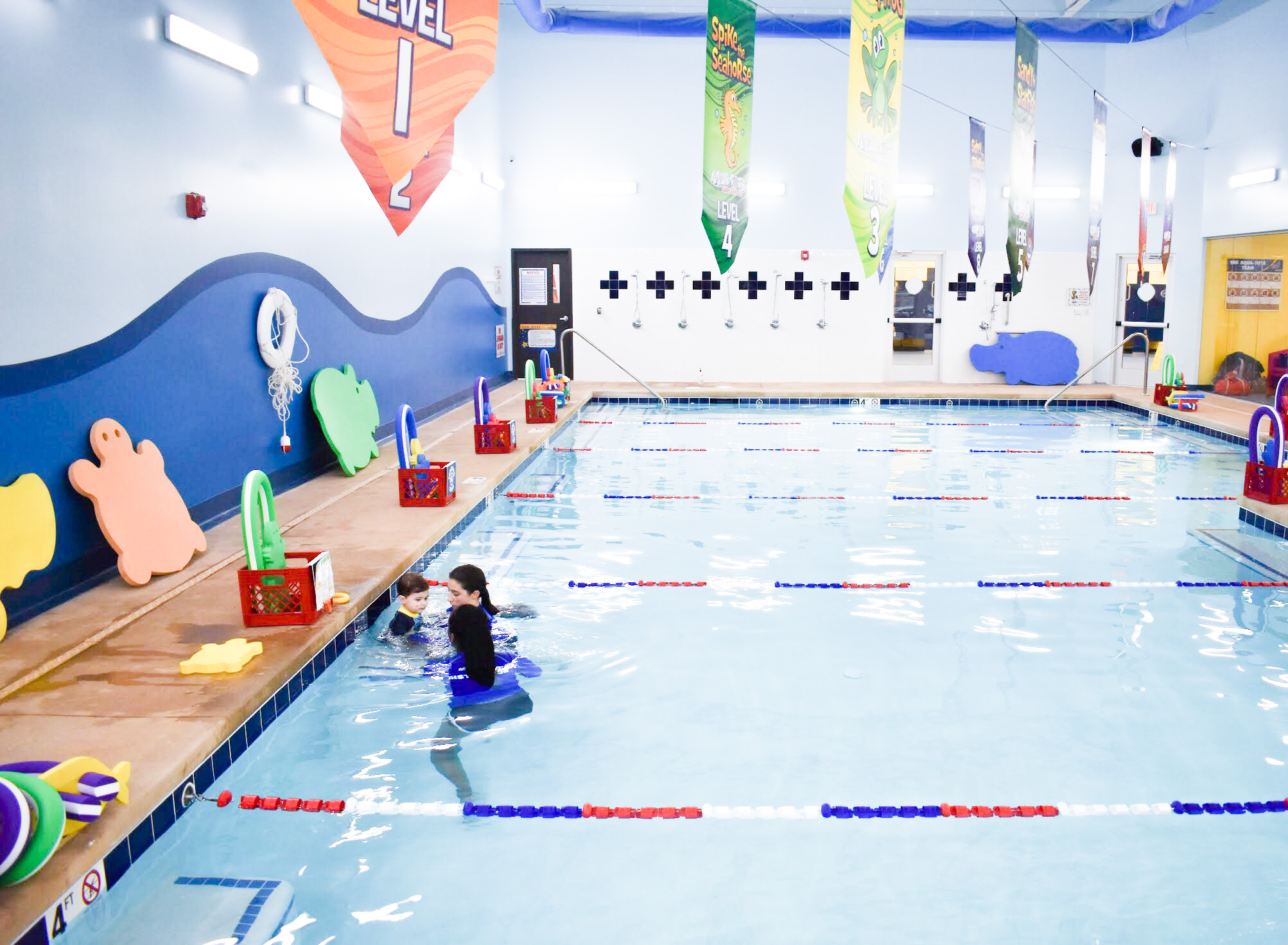 What to Expect at Baby Swim Lessons: Prepare yourself and your child for their first swim lesson with these tips! My infant and preschooler take lessons at Aqua-Tots Swim School in Olathe, KS. Here's what I learned from the pros about baby swim lessons and getting kids acclimated to the water!