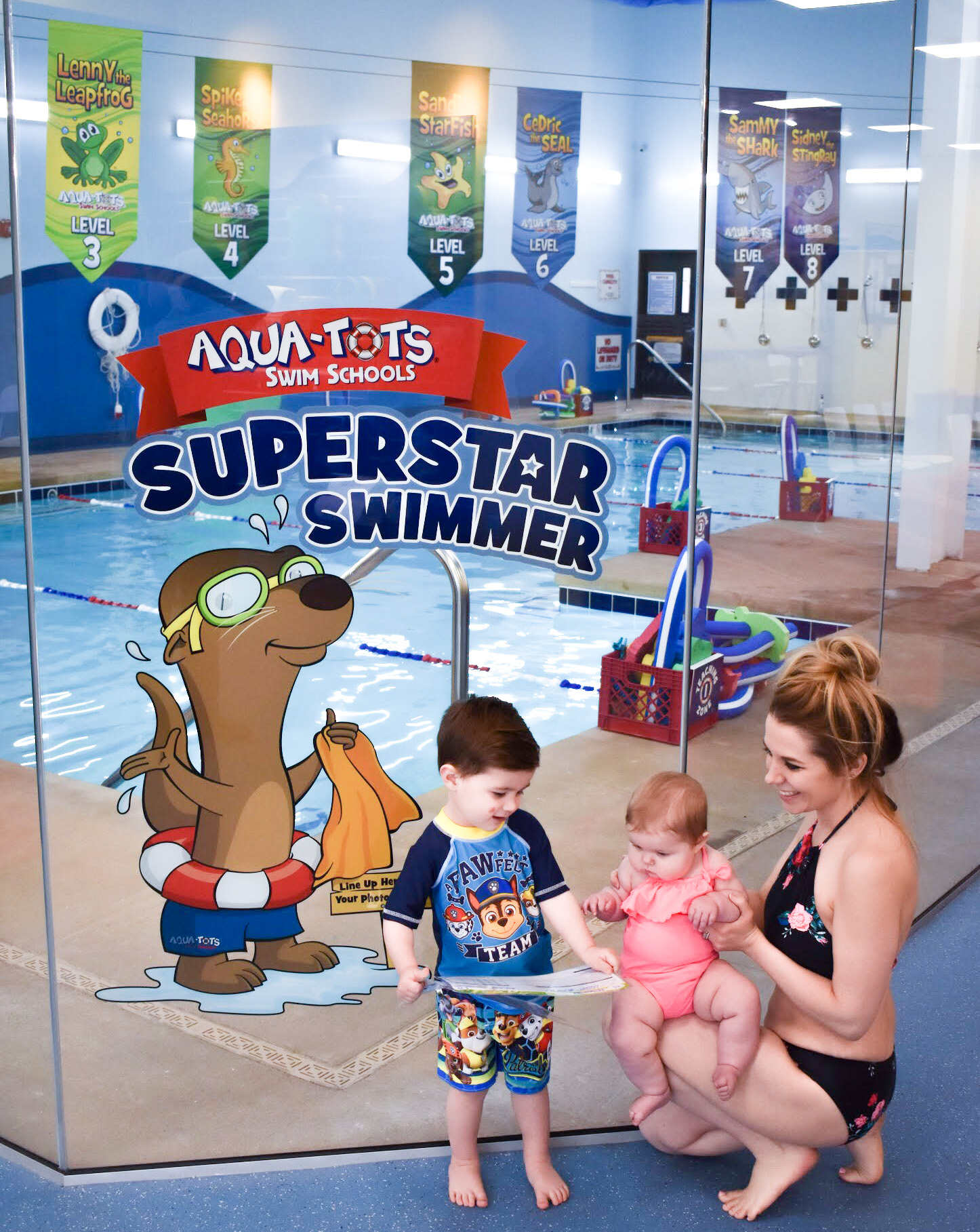 What to Expect at Baby Swim Lessons: Prepare yourself and your child for their first swim lesson with these tips! My infant and preschooler take lessons at Aqua-Tots Swim School in Olathe, KS. Here's what I learned from the pros about baby swim lessons and getting kids acclimated to the water!