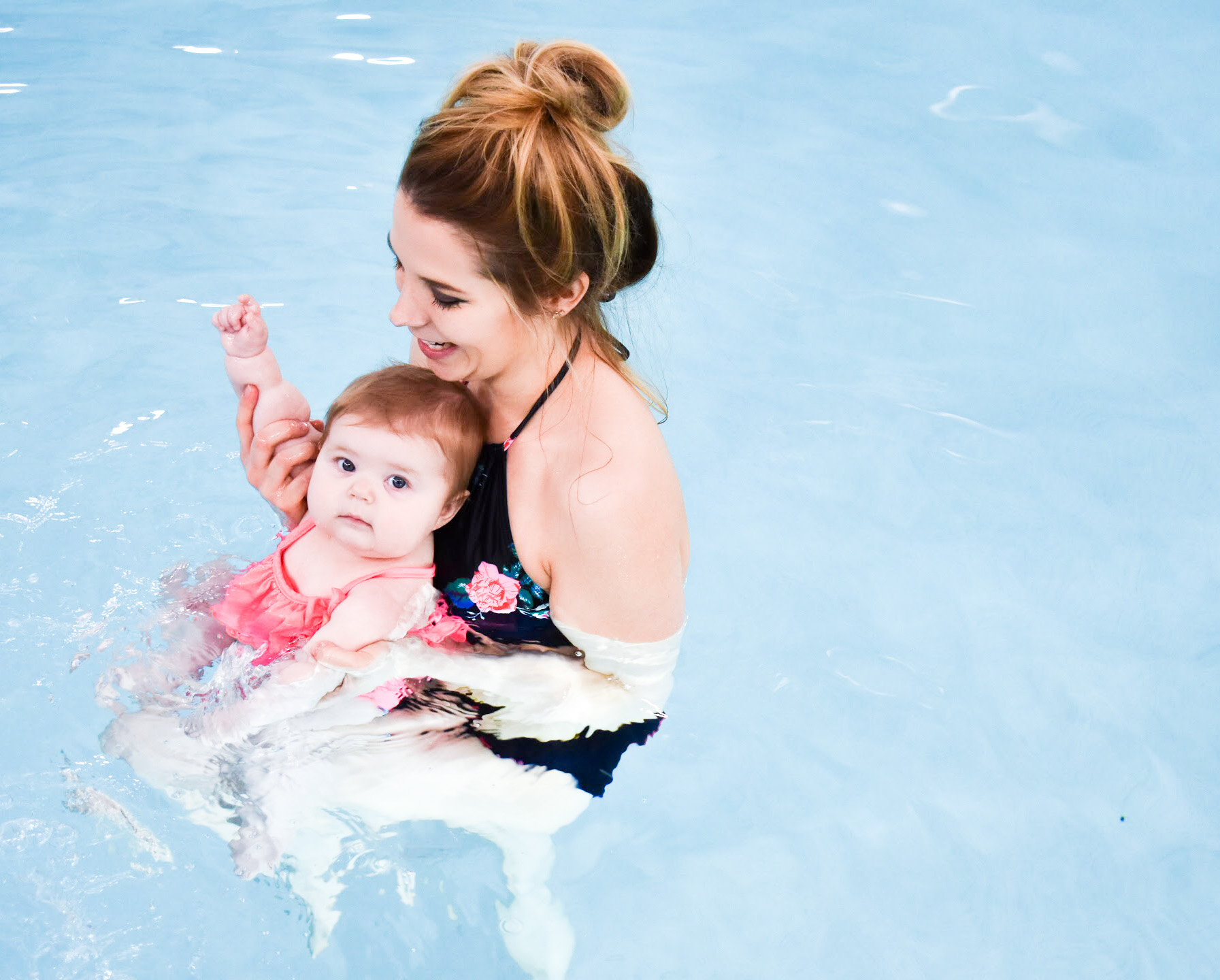 What to Expect at Baby Swim Lessons: Prepare yourself and your child for their first swim lesson with these tips! My infant and preschooler take lessons at Aqua-Tots Swim School in Olathe, KS. Here's what I learned from the pros about baby swim lessons and getting kids acclimated to the water!