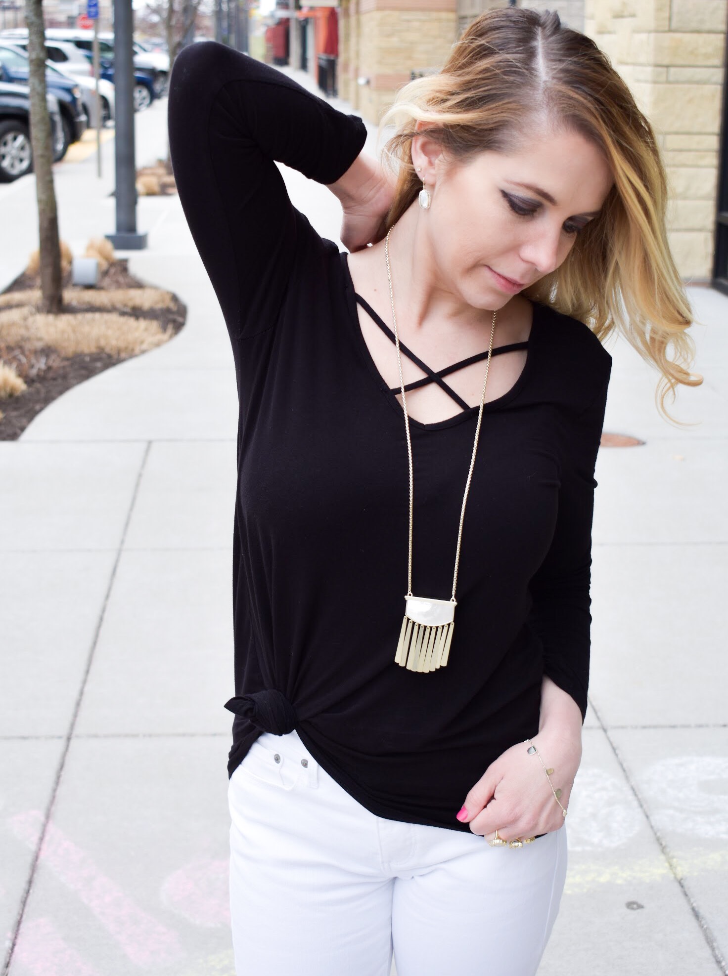 Monochrome Kendra Scott Jewelry Look: Kansas City fashion blogger COVET by tricia showcases a black and white spring transitional spring style featuring Kendra Scott jewelry. Here's how to style a knotted blouse with white pants, peep-toe heels, and gorgeous jewelry from Kendra Scott. The jewelry used in this post is available from Threshing Bee in Overland Park, KS.