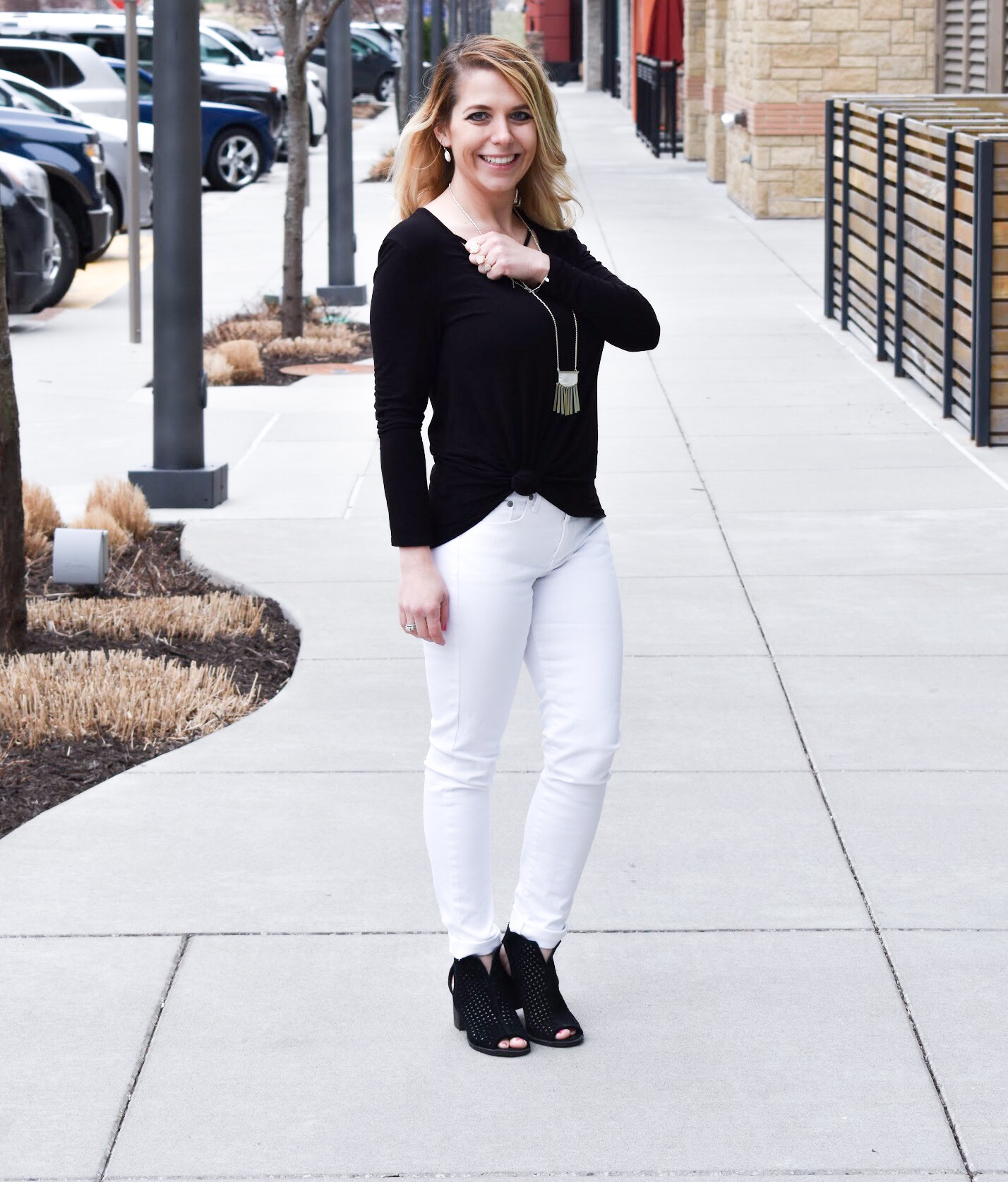 Monochrome Kendra Scott Jewelry Look: Kansas City fashion blogger COVET by tricia showcases a black and white spring transitional spring style featuring Kendra Scott jewelry. Here's how to style a knotted blouse with white pants, peep-toe heels, and gorgeous jewelry from Kendra Scott. The jewelry used in this post is available from Threshing Bee in Overland Park, KS.