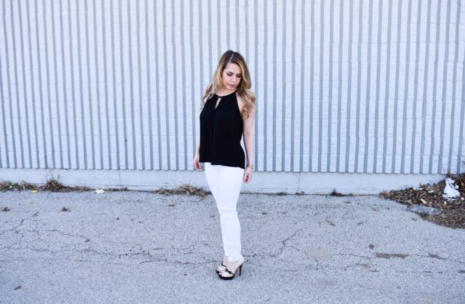 Monochrome Looks for Spring: Some people think you can't wear black and white in the spring. Those people are wrong. Fashion blogger COVET by tricia showcases a springtime monochrome look featuring Banana Republic Stay White Denim and a Tyche black halter top. Minimalist jewelry completes the look. Monochrome is trending for spring 2018, so here's how to effortlessly incorporate it into your wardrobe.