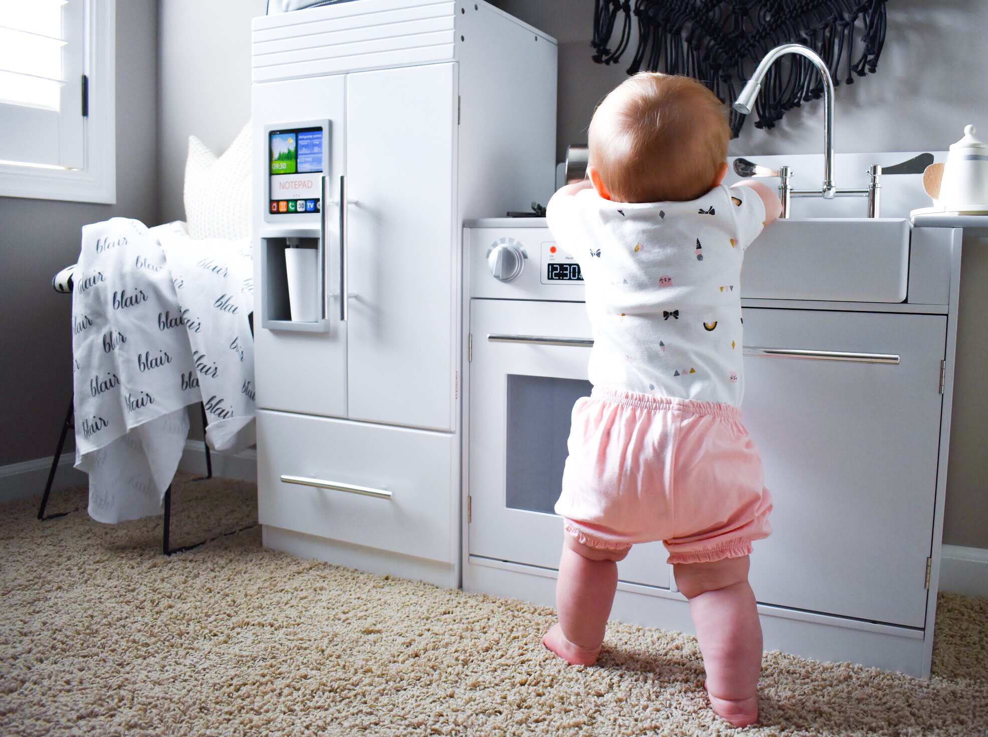 Baby Girl Summer Wardrobe - Building a Capsule Wardrobe for Baby. Here's how I built a capsule wardrobe for Baby Girl's summer clothes. A minimalist monochrome baby girl wardrobe in black, white and grey, with touches of baby pink. Simplify your mornings by getting Baby dressed faster and keep her looking stylish with this easy-to-follow advice.