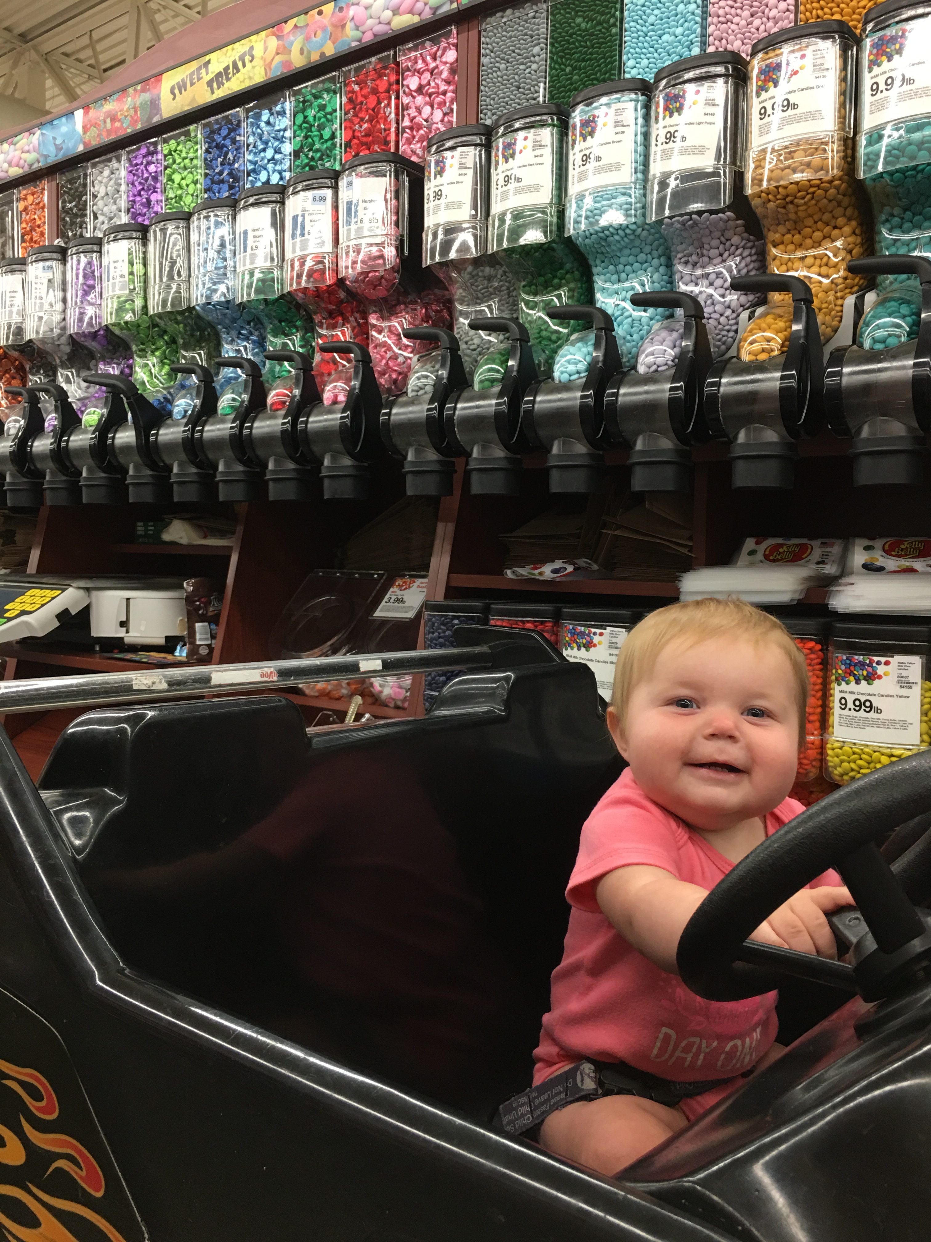 Baby in Car Cart Buying Candy e1529355018970