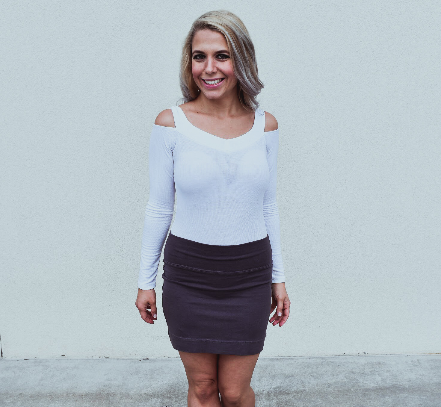 How to Wear a Bodysuit - White Bodysuit and Mini Skirt Style: Fashion blogger COVET by tricia shows how to wear a bodysuit by showcasing a white bodysuit and mini skirt outfit. Bodysuits are one of the biggest trends as of late, but it can be difficult to work them into your existing wardrobe. Here's how to style a bodysuit with items already in your closet! This white off-the-shoulder bodysuit is a sexy look for day or night. COVET by tricia is a Kansas City blogger focusing on fashion and lifestyle.