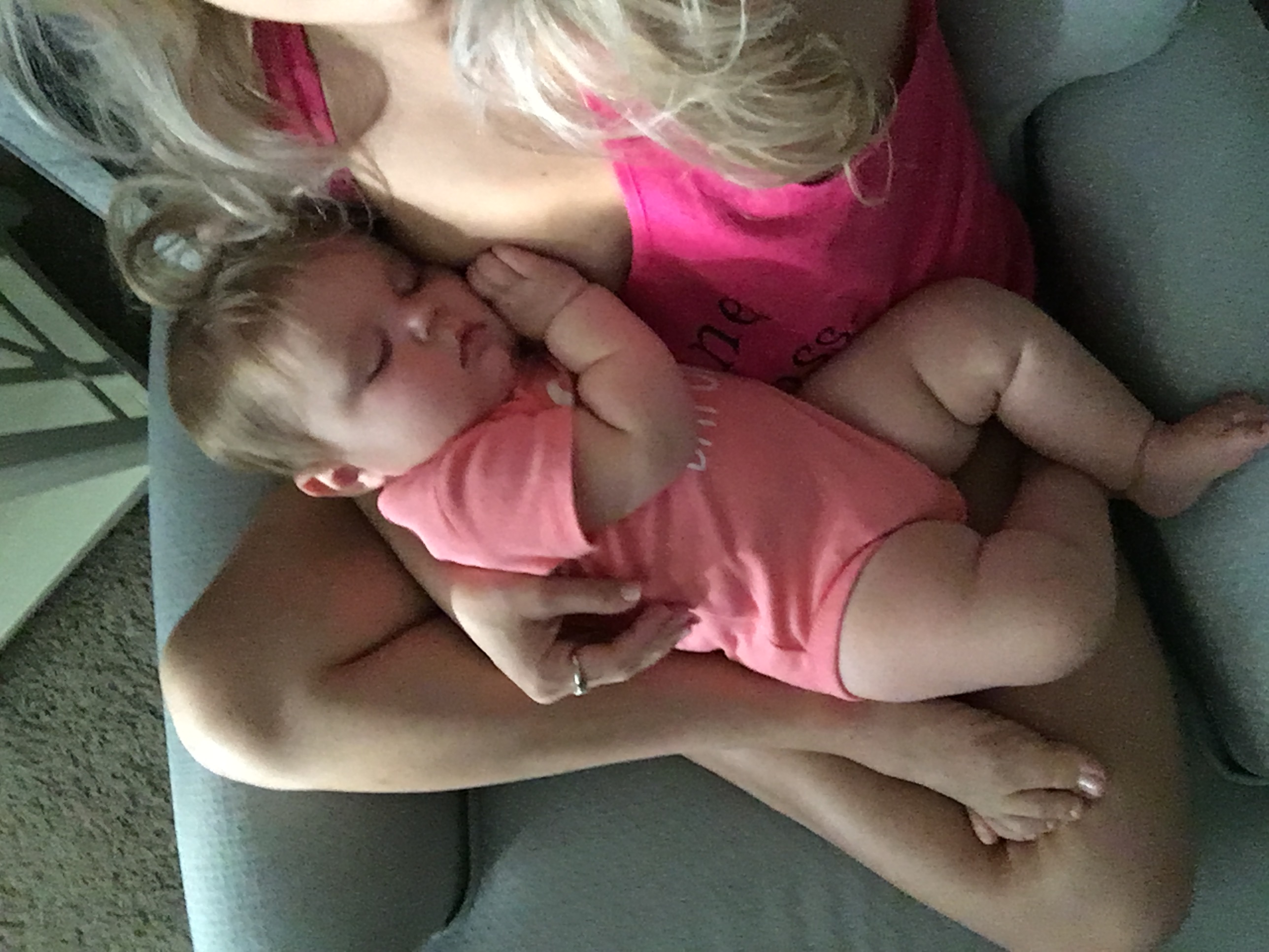 Mom Cuddling Breastfed Baby
