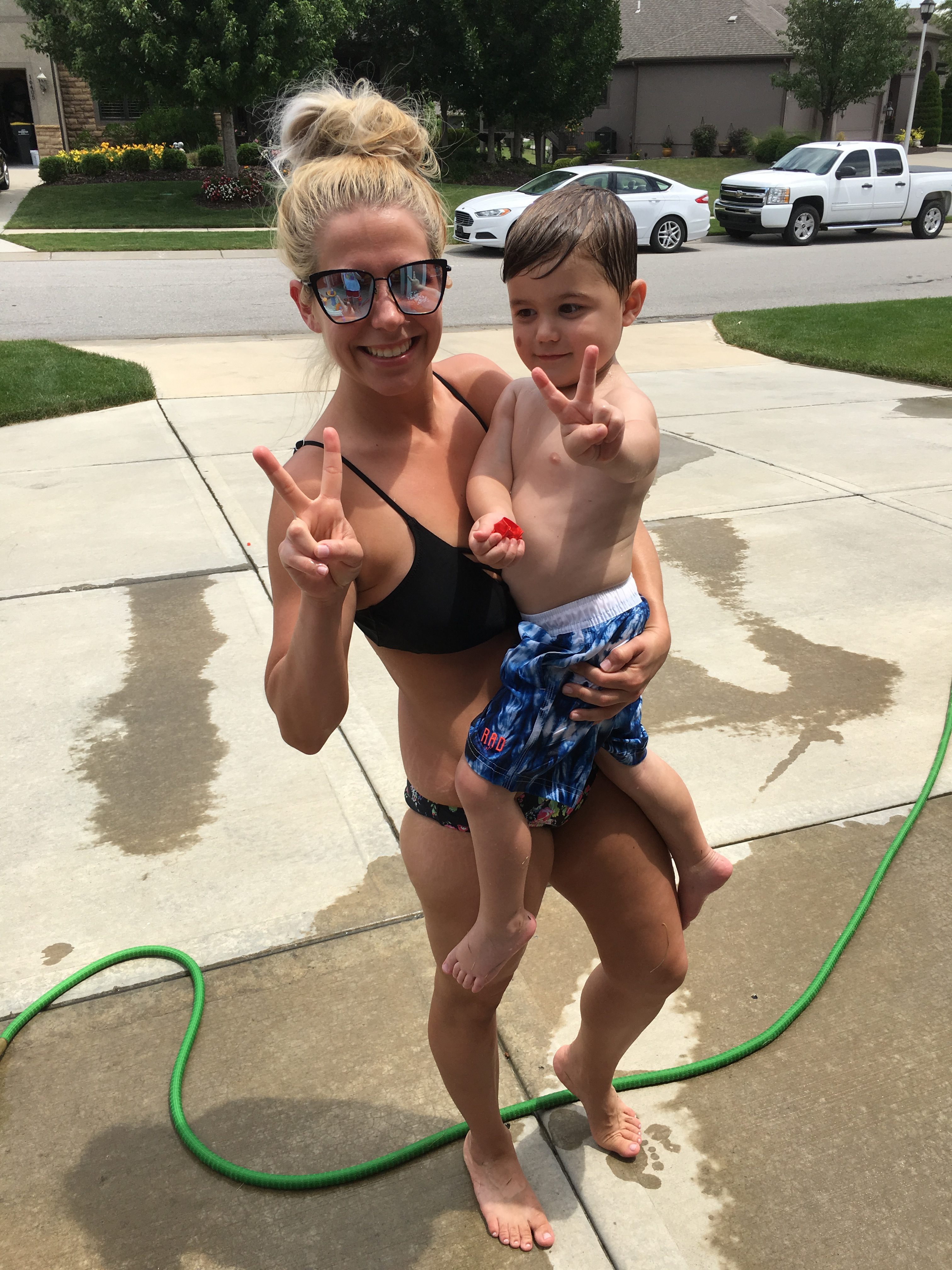 Mom in Bikini and Toddler Son Playing Outside e1529354985361