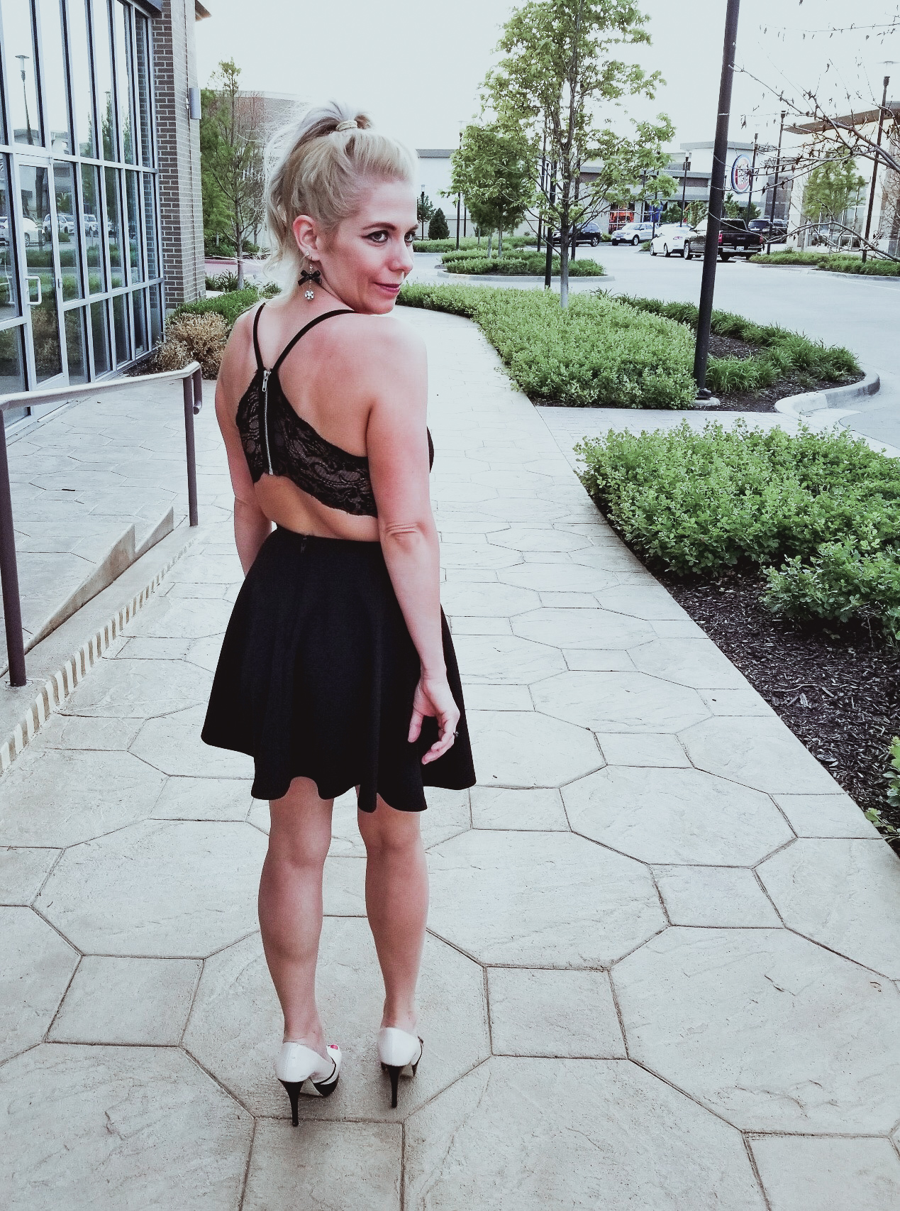 Perfect Affordable LBD for Summer 2018: This little black dress is stylish, flirty, and around $30! Fashion blogger COVET by tricia showcases this unique black lace back dress with platform heels to create a stunning summer 2018 fashion look. You'll definitely want to show off the zipper and lace back on this affordable LBD!