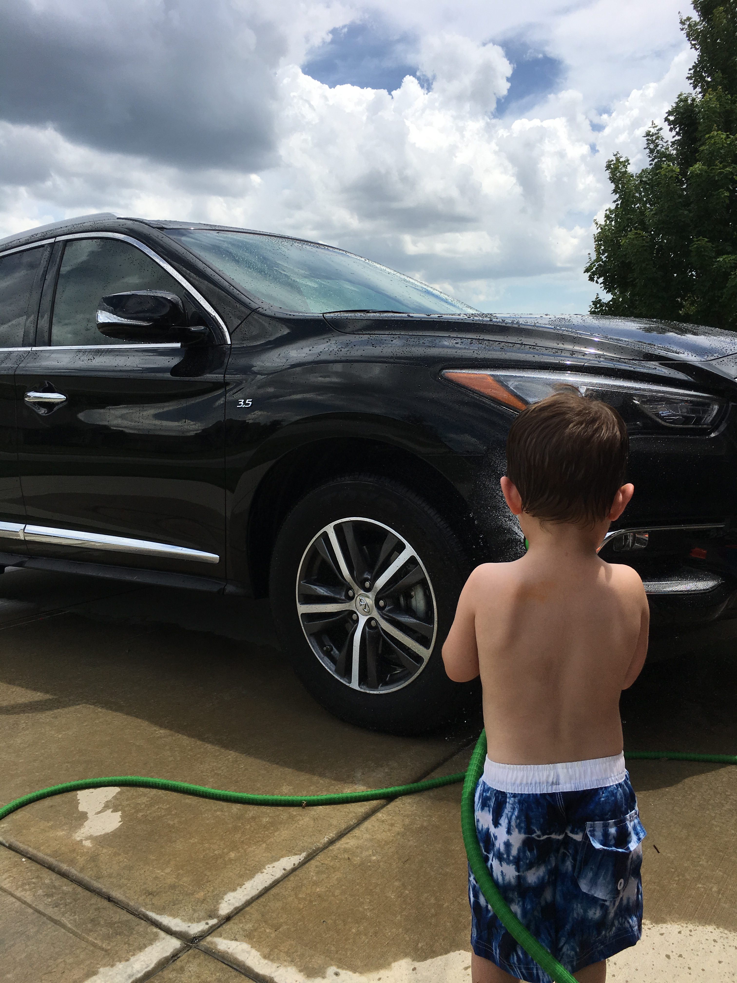 Toddler Boy Washing Infiniti QX60 e1529354942879