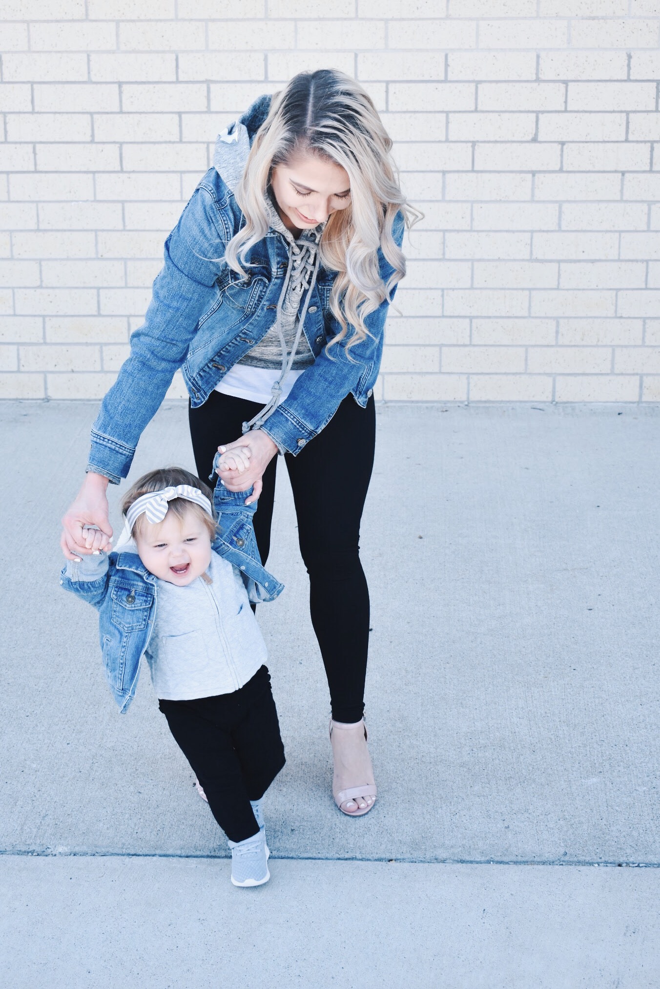 Mommy and Me Matching Outfits - Mom and Baby Girl Matching Outfits - Here's some of the best Mommy and Me Outfit Ideas on the Internet! This casual Mommy and Me style jean jacket over hoodie look can work for a baby girl or baby boy and is easy to pull together with items you both probably already have in your closets. Jean jacket outfit ideas, Hoodie outfit ideas, Casual Fall Style, Casual Fall Outfit. #LikeTKit #Fashion #MommyandMe #Twinning