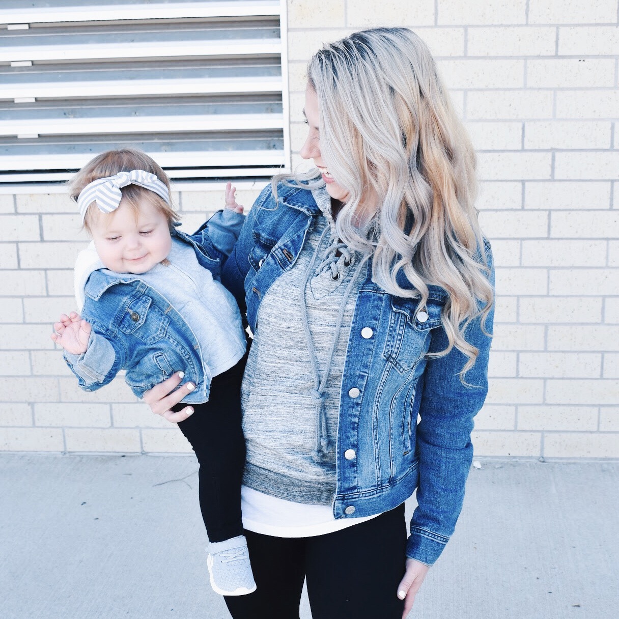 Mommy and Me Matching Outfits - Mom and Baby Girl Matching Outfits - Here's some of the best Mommy and Me Outfit Ideas on the Internet! This casual Mommy and Me style jean jacket over hoodie look can work for a baby girl or baby boy and is easy to pull together with items you both probably already have in your closets. Jean jacket outfit ideas, Hoodie outfit ideas, Casual Fall Style, Casual Fall Outfit. #LikeTKit #Fashion #MommyandMe #Twinning