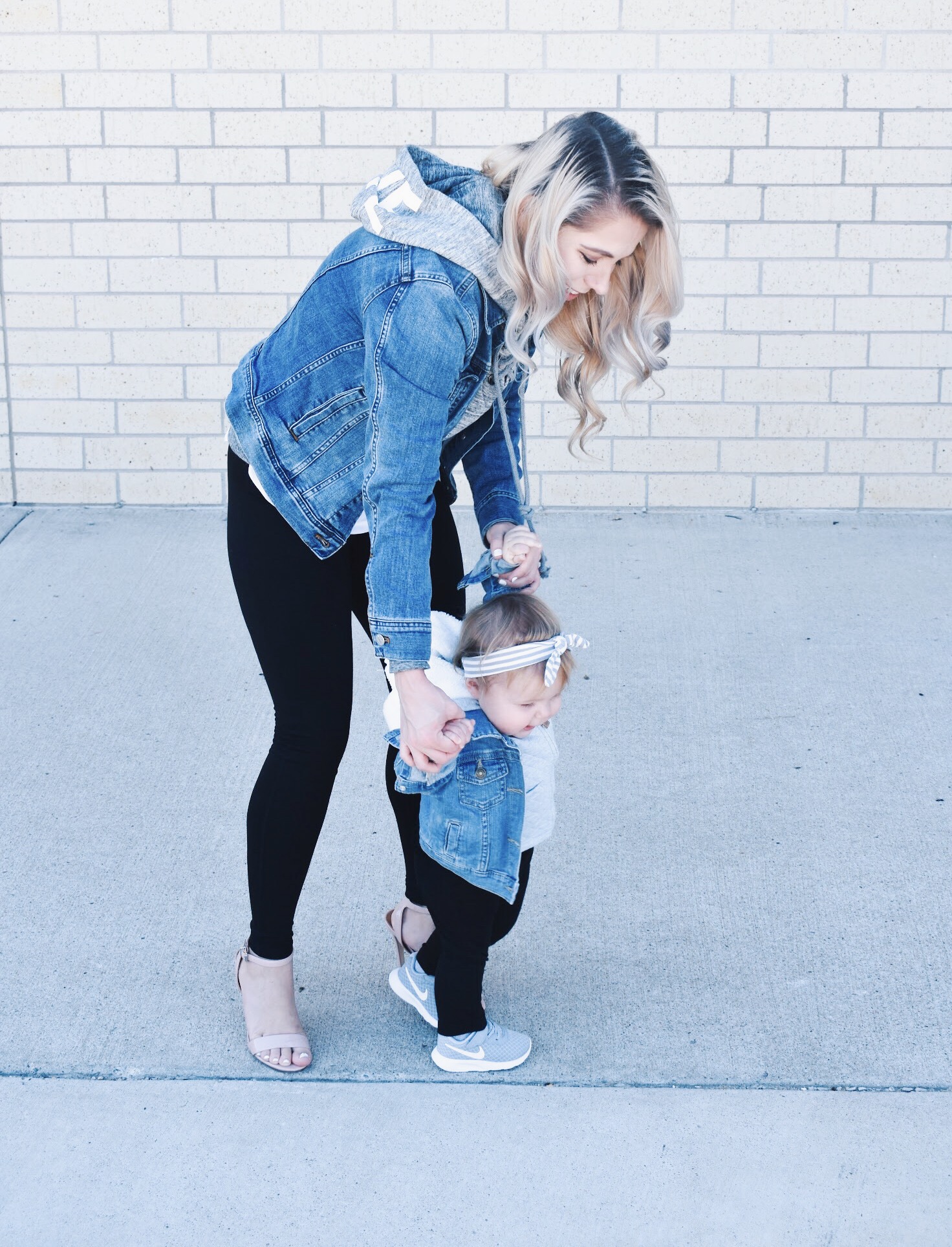 Mommy and Me Matching Outfits - Mom and Baby Girl Matching Outfits - Here's some of the best Mommy and Me Outfit Ideas on the Internet! This casual Mommy and Me style jean jacket over hoodie look can work for a baby girl or baby boy and is easy to pull together with items you both probably already have in your closets. Jean jacket outfit ideas, Hoodie outfit ideas, Casual Fall Style, Casual Fall Outfit. #LikeTKit #Fashion #MommyandMe #Twinning