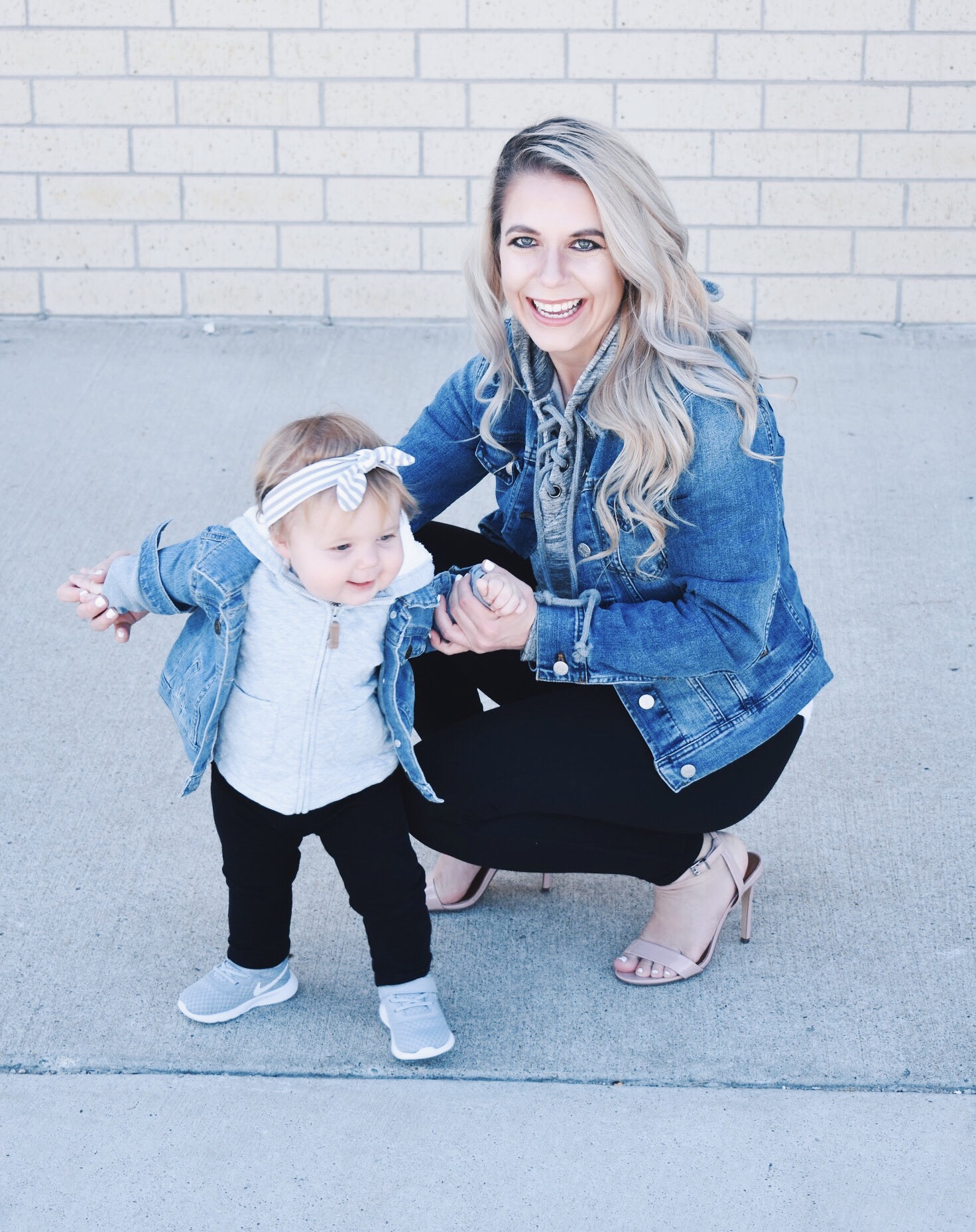 Mommy and Me Matching Outfits - Mom and Baby Girl Matching Outfits - Here's some of the best Mommy and Me Outfit Ideas on the Internet! This casual Mommy and Me style jean jacket over hoodie look can work for a baby girl or baby boy and is easy to pull together with items you both probably already have in your closets. Jean jacket outfit ideas, Hoodie outfit ideas, Casual Fall Style, Casual Fall Outfit. #LikeTKit #Fashion #MommyandMe #Twinning