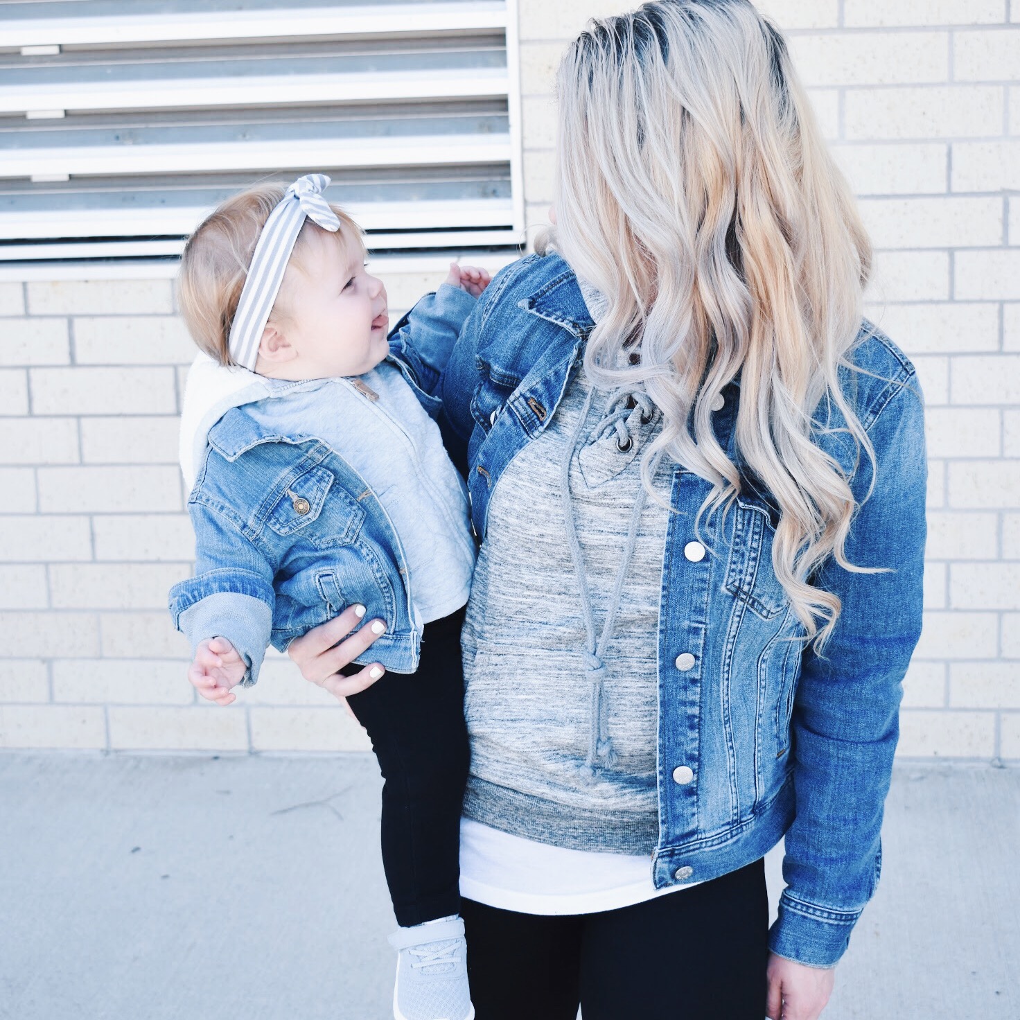 Mommy and Me Matching Outfits - Mom and Baby Girl Matching Outfits - Here's some of the best Mommy and Me Outfit Ideas on the Internet! This casual Mommy and Me style jean jacket over hoodie look can work for a baby girl or baby boy and is easy to pull together with items you both probably already have in your closets. Jean jacket outfit ideas, Hoodie outfit ideas, Casual Fall Style, Casual Fall Outfit. #LikeTKit #Fashion #MommyandMe #Twinning