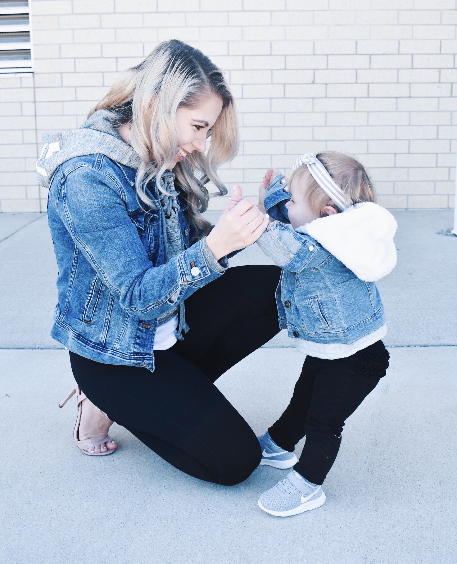 Mommy and Me Matching Outfits - Mom and Baby Girl Matching Outfits - Here's some of the best Mommy and Me Outfit Ideas on the Internet! This casual Mommy and Me style jean jacket over hoodie look can work for a baby girl or baby boy and is easy to pull together with items you both probably already have in your closets. Jean jacket outfit ideas, Hoodie outfit ideas, Casual Fall Style, Casual Fall Outfit. #LikeTKit #Fashion #MommyandMe #Twinning