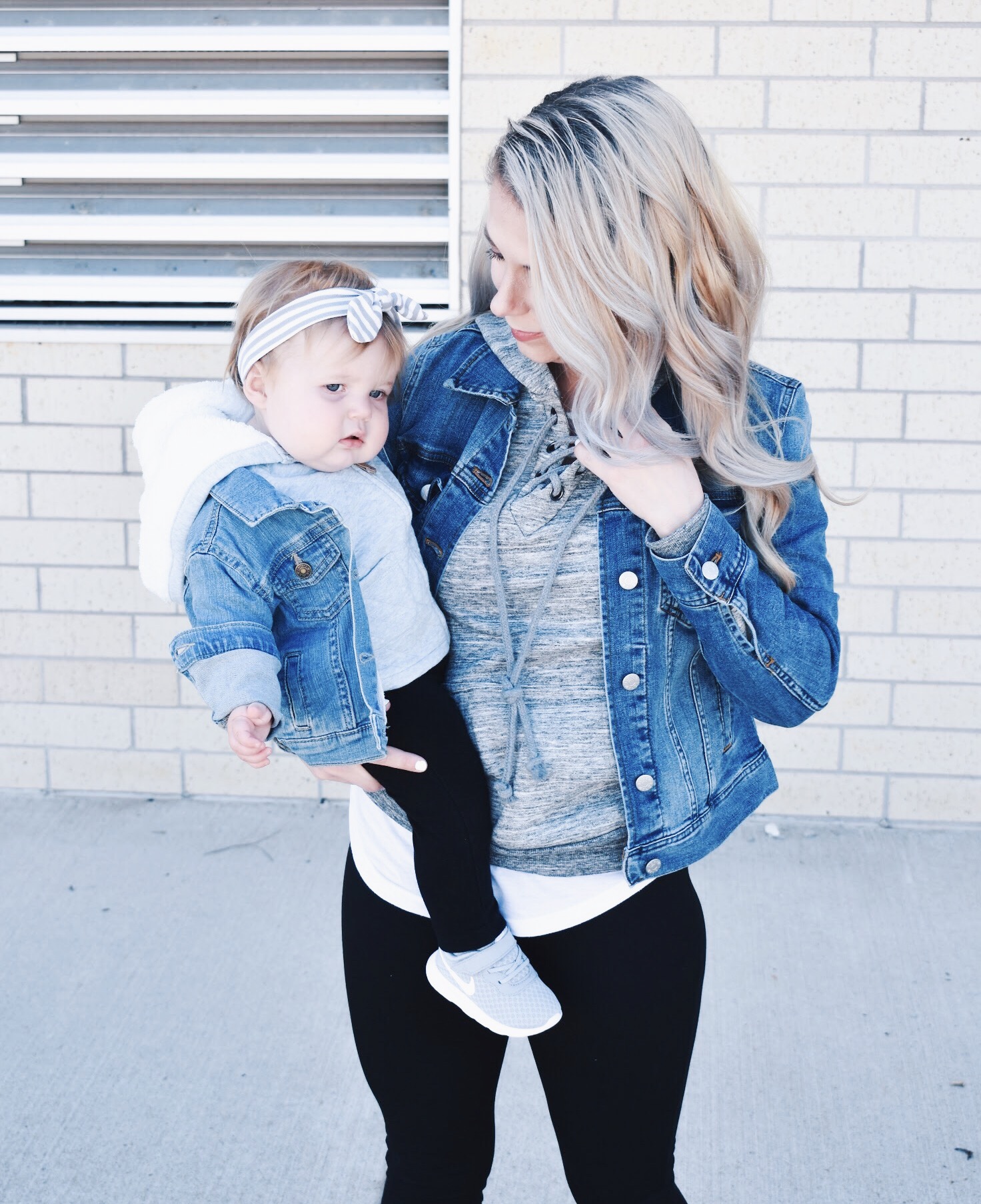 Mommy and Me Matching Outfits - Mom and Baby Girl Matching Outfits - Here's some of the best Mommy and Me Outfit Ideas on the Internet! This casual Mommy and Me style jean jacket over hoodie look can work for a baby girl or baby boy and is easy to pull together with items you both probably already have in your closets. Jean jacket outfit ideas, Hoodie outfit ideas, Casual Fall Style, Casual Fall Outfit. #LikeTKit #Fashion #MommyandMe #Twinning