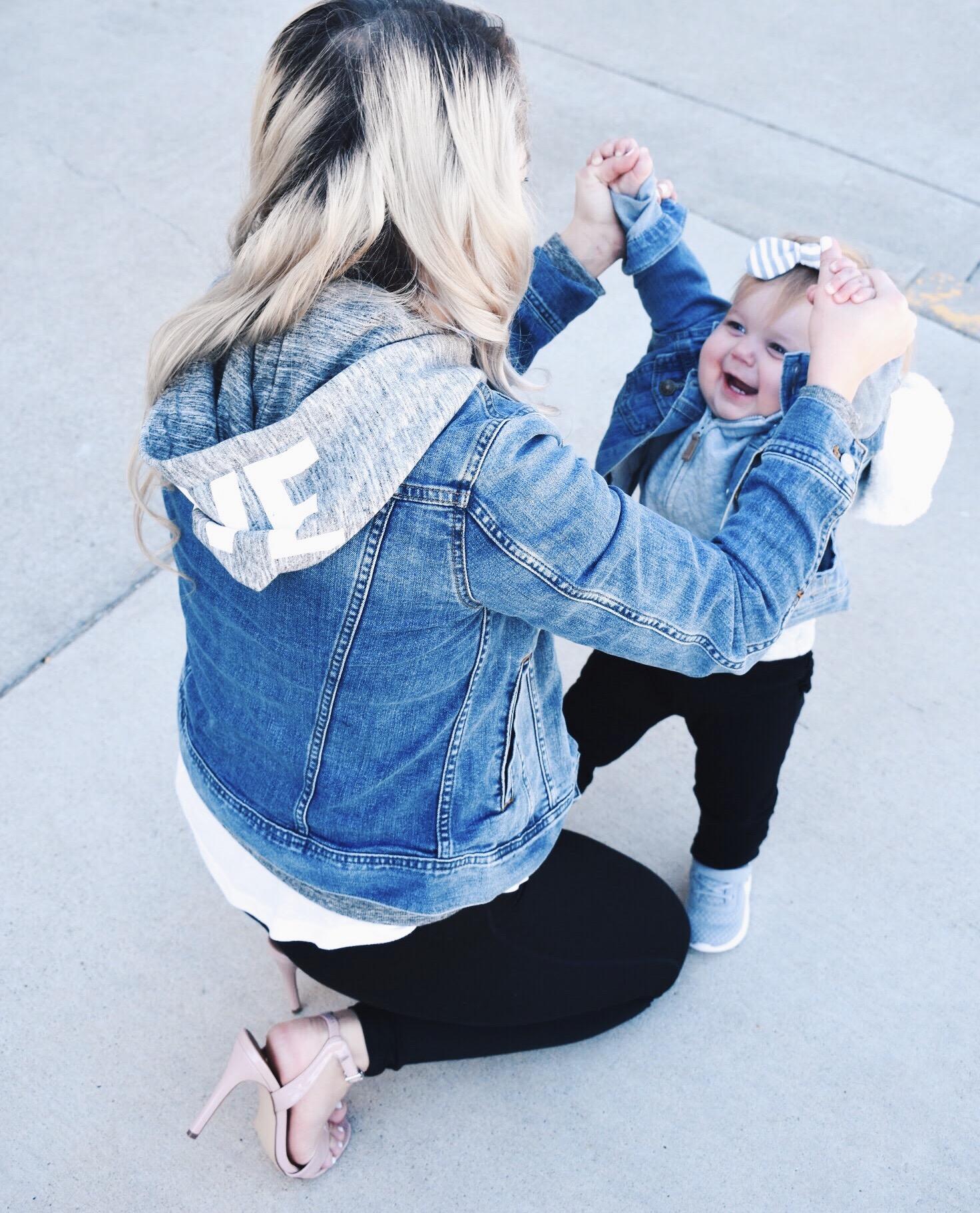 Mommy and Me Matching Outfits - Mom and Baby Girl Matching Outfits - Here's some of the best Mommy and Me Outfit Ideas on the Internet! This casual Mommy and Me style jean jacket over hoodie look can work for a baby girl or baby boy and is easy to pull together with items you both probably already have in your closets. Jean jacket outfit ideas, Hoodie outfit ideas, Casual Fall Style, Casual Fall Outfit. #LikeTKit #Fashion #MommyandMe #Twinning