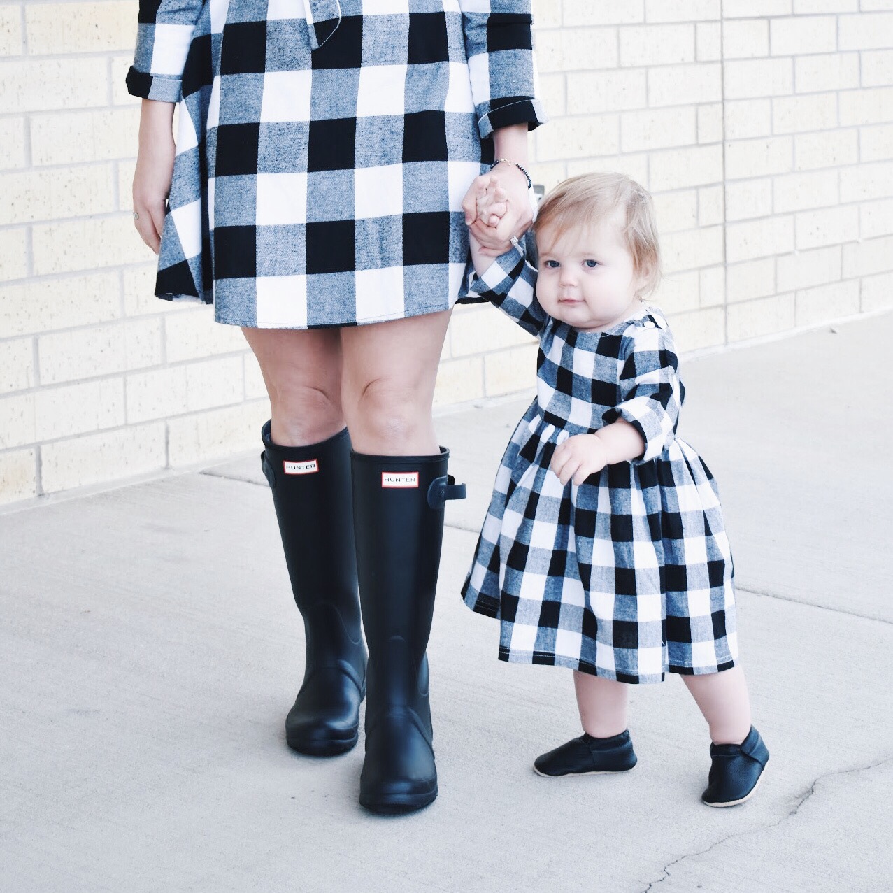 Mommy and Me Dresses - Fall Matching Clothes for Mommy and Daughter. These Mommy and Me plaid dresses are perfect for twinning with your mini me. Best of all, they're super affordable -- you can get both dresses for around $30 total! Perfect Mommy and Me outfit inspo from fashion blogger Tricia Nibarger of COVET by tricia, showcasing plaid dresses for Mom and Daughter. #MommyandMe #GirlMom #LikeTKit