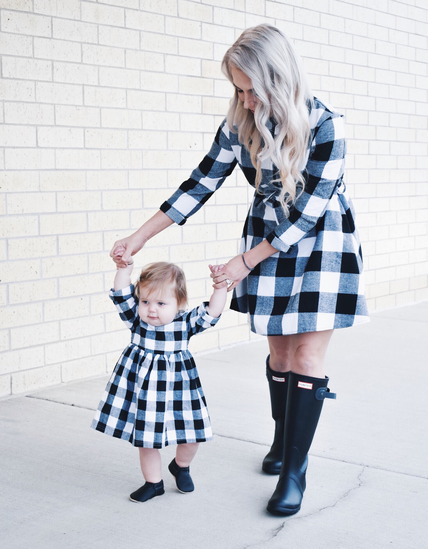 Mommy and Me Dresses - Fall Matching Clothes for Mommy and Daughter. These Mommy and Me plaid dresses are perfect for twinning with your mini me. Best of all, they're super affordable -- you can get both dresses for around $30 total! Perfect Mommy and Me outfit inspo from fashion blogger Tricia Nibarger of COVET by tricia, showcasing plaid dresses for Mom and Daughter. #MommyandMe #GirlMom #LikeTKit