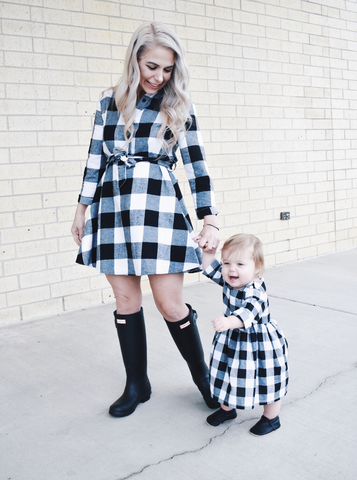 Mommy and Me Dresses - Fall Matching Clothes for Mommy and Daughter. These Mommy and Me plaid dresses are perfect for twinning with your mini me. Best of all, they're super affordable -- you can get both dresses for around $30 total! Perfect Mommy and Me outfit inspo from fashion blogger Tricia Nibarger of COVET by tricia, showcasing plaid dresses for Mom and Daughter. #MommyandMe #GirlMom #LikeTKit