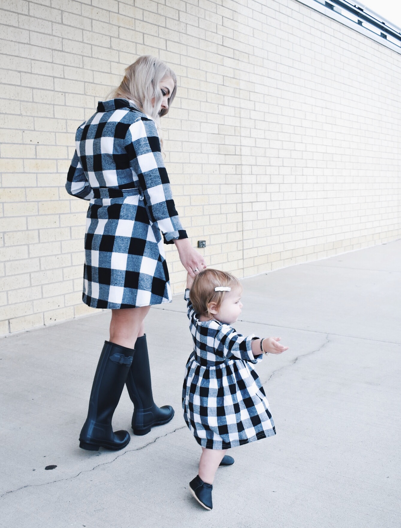 Mommy and Me Dresses - Fall Matching Clothes for Mommy and Daughter. These Mommy and Me plaid dresses are perfect for twinning with your mini me. Best of all, they're super affordable -- you can get both dresses for around $30 total! Perfect Mommy and Me outfit inspo from fashion blogger Tricia Nibarger of COVET by tricia, showcasing plaid dresses for Mom and Daughter. #MommyandMe #GirlMom #LikeTKit