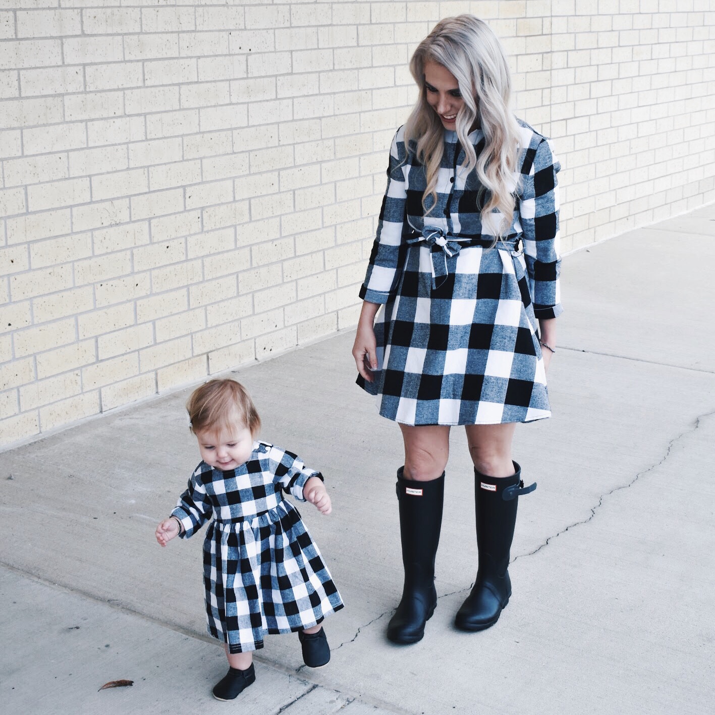 Mommy and Me Dresses - Fall Matching Clothes for Mommy and Daughter. These Mommy and Me plaid dresses are perfect for twinning with your mini me. Best of all, they're super affordable -- you can get both dresses for around $30 total! Perfect Mommy and Me outfit inspo from fashion blogger Tricia Nibarger of COVET by tricia, showcasing plaid dresses for Mom and Daughter. #MommyandMe #GirlMom #LikeTKit