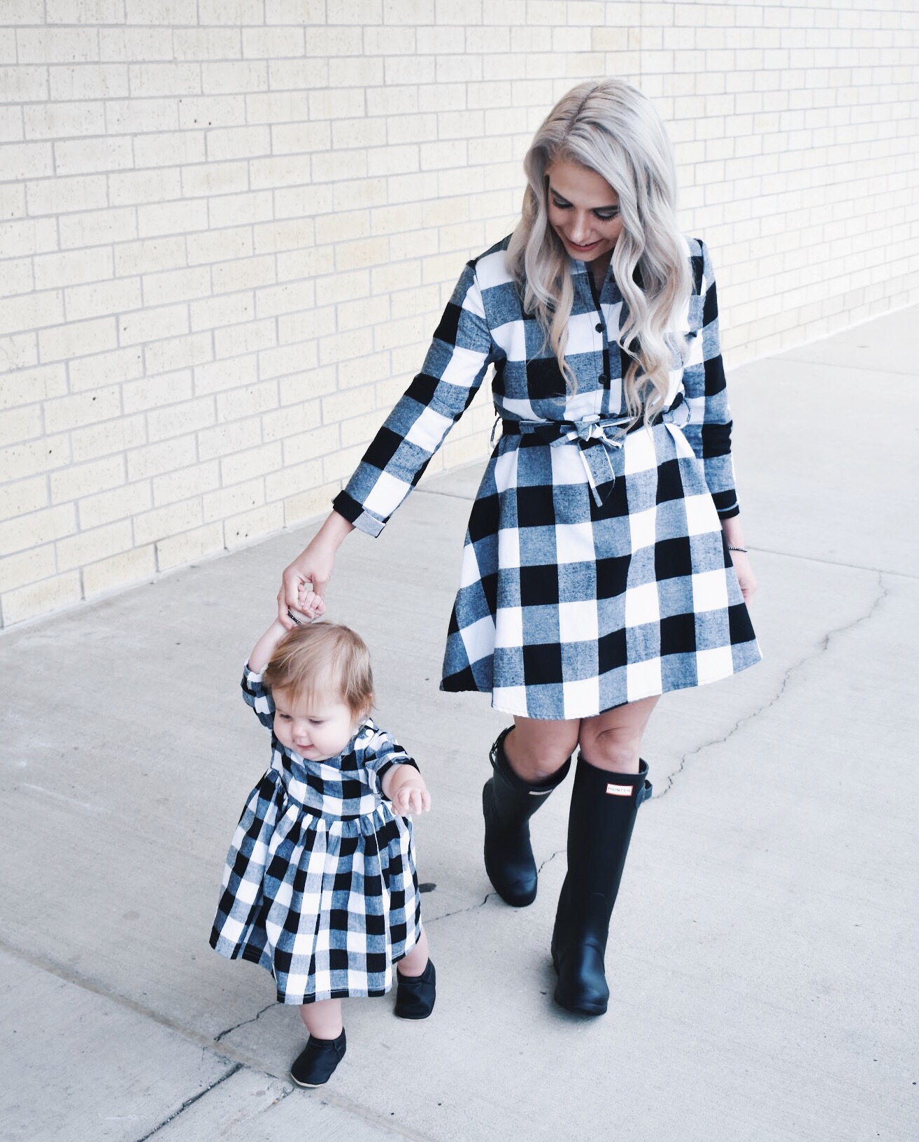 Mommy and Me Dresses - Fall Matching Clothes for Mommy and Daughter. These Mommy and Me plaid dresses are perfect for twinning with your mini me. Best of all, they're super affordable -- you can get both dresses for around $30 total! Perfect Mommy and Me outfit inspo from fashion blogger Tricia Nibarger of COVET by tricia, showcasing plaid dresses for Mom and Daughter. #MommyandMe #GirlMom #LikeTKit