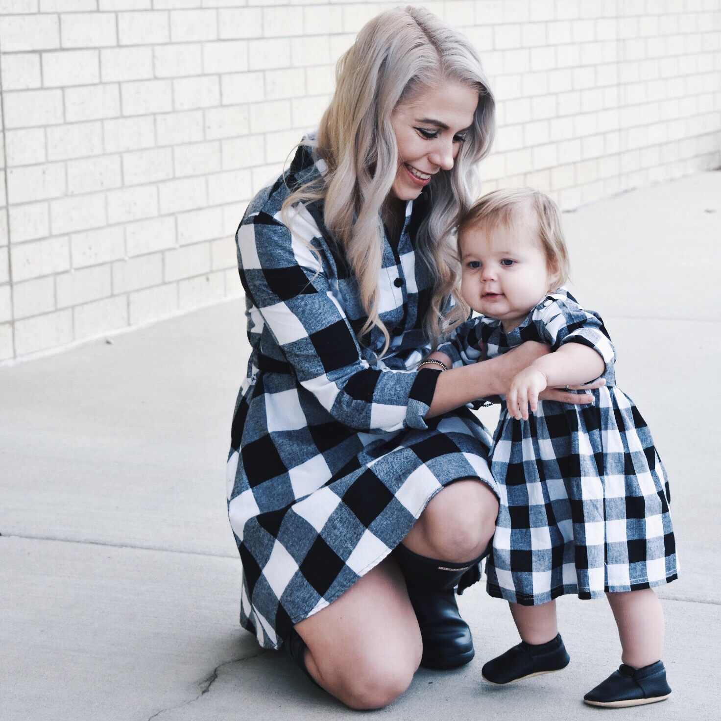 Mommy and Me Dresses - Fall Matching Clothes for Mommy and Daughter. These Mommy and Me plaid dresses are perfect for twinning with your mini me. Best of all, they're super affordable -- you can get both dresses for around $30 total! Perfect Mommy and Me outfit inspo from fashion blogger Tricia Nibarger of COVET by tricia, showcasing plaid dresses for Mom and Daughter. #MommyandMe #GirlMom #LikeTKit