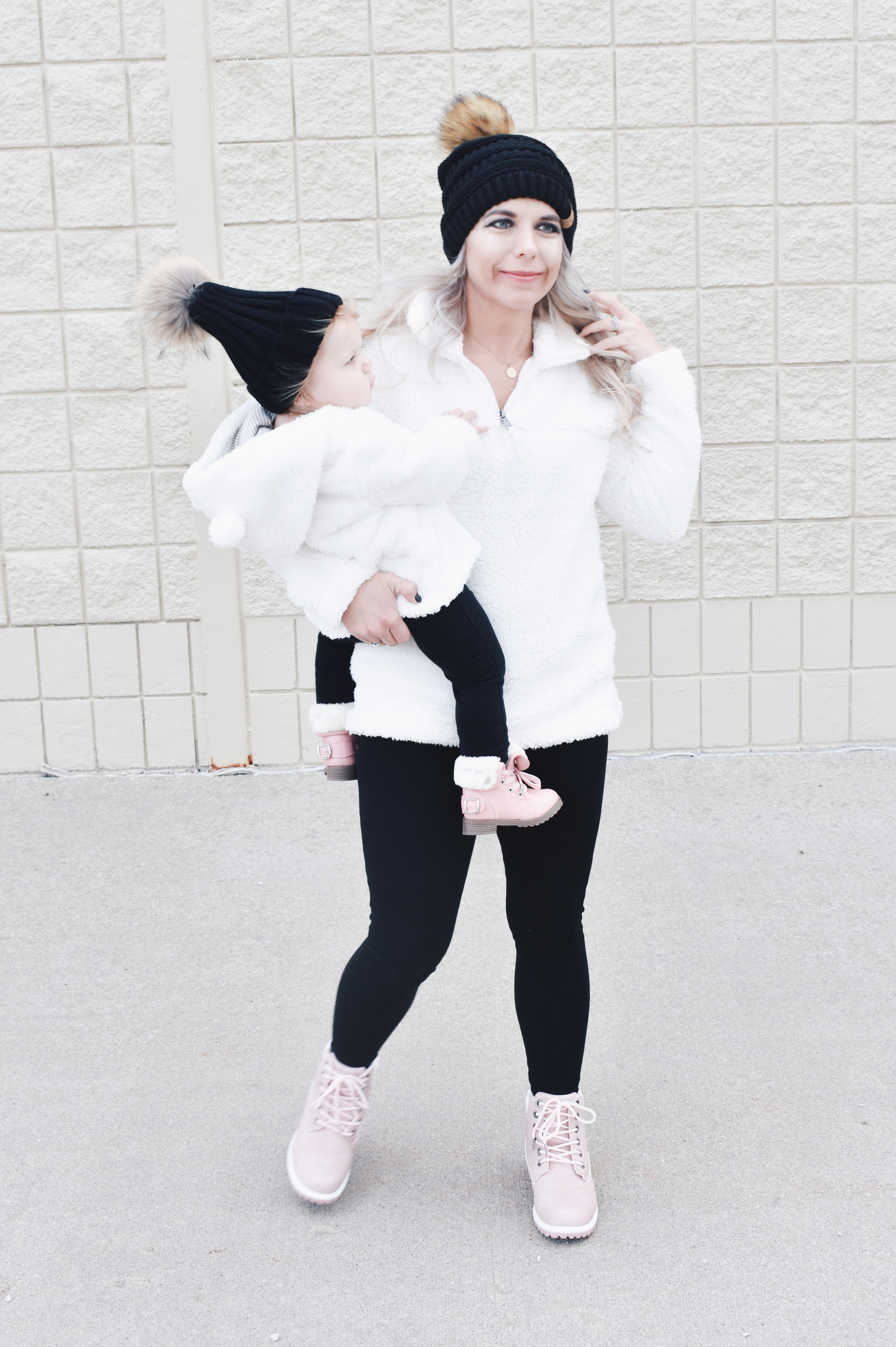 Mom and Daughter Matching Winter Outfits - Get inspo for the perfect mommy and daughter matching outfits for winter! These cozy white sherpa jackets will keep mom and baby girl warm this winter, and the matching mother daughter pink boots are to die for! Top it off with matching mommy and me pom beanie hats and you'll be the most stylish duo in town! #MommyandMe #MomandMe #LTKFamily #LTKKids