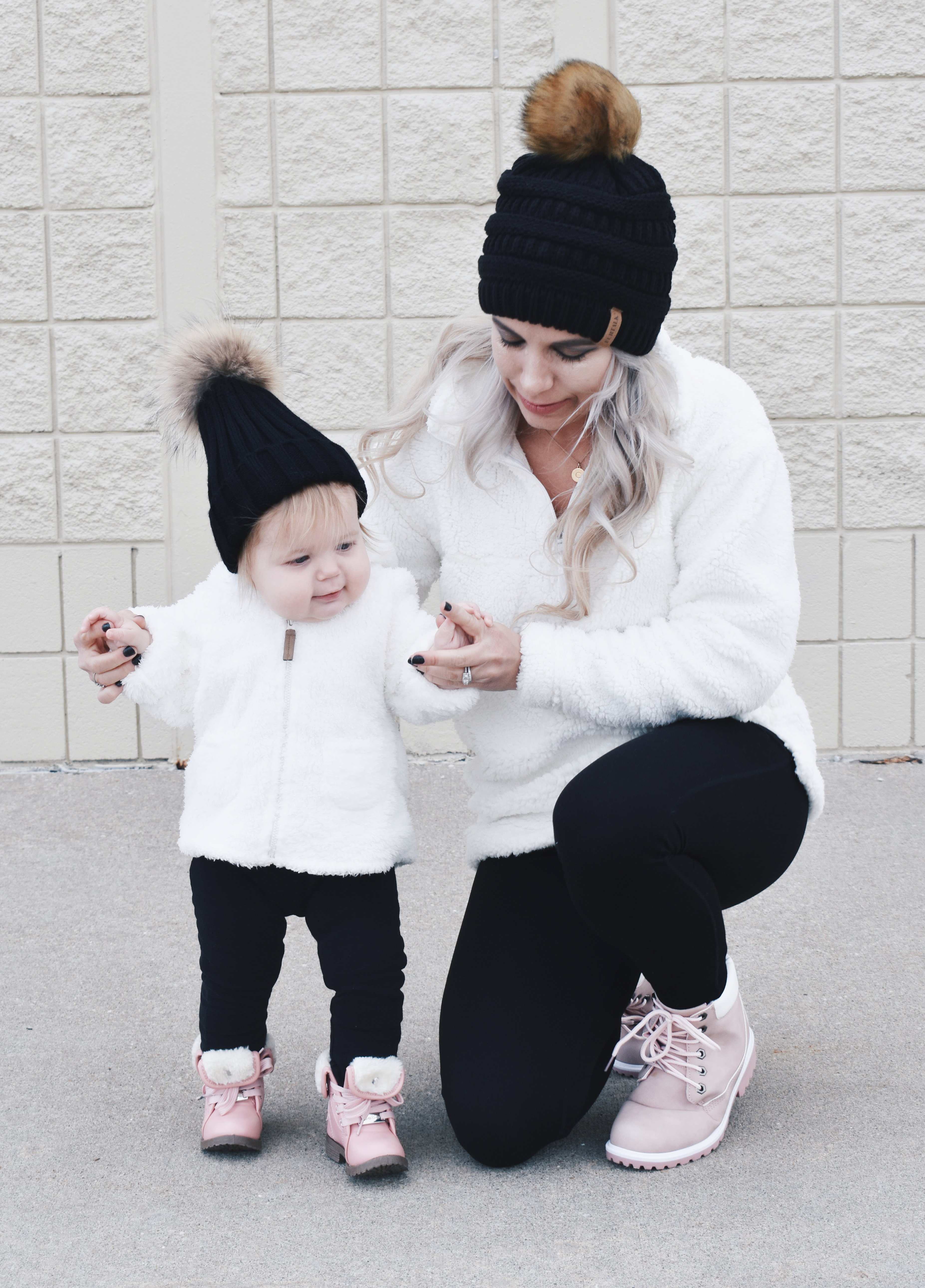 Mom and Daughter Matching Winter Outfits - Get inspo for the perfect mommy and daughter matching outfits for winter! These cozy white sherpa jackets will keep mom and baby girl warm this winter, and the matching mother daughter pink boots are to die for! Top it off with matching mommy and me pom beanie hats and you'll be the most stylish duo in town! #MommyandMe #MomandMe #LTKFamily #LTKKids