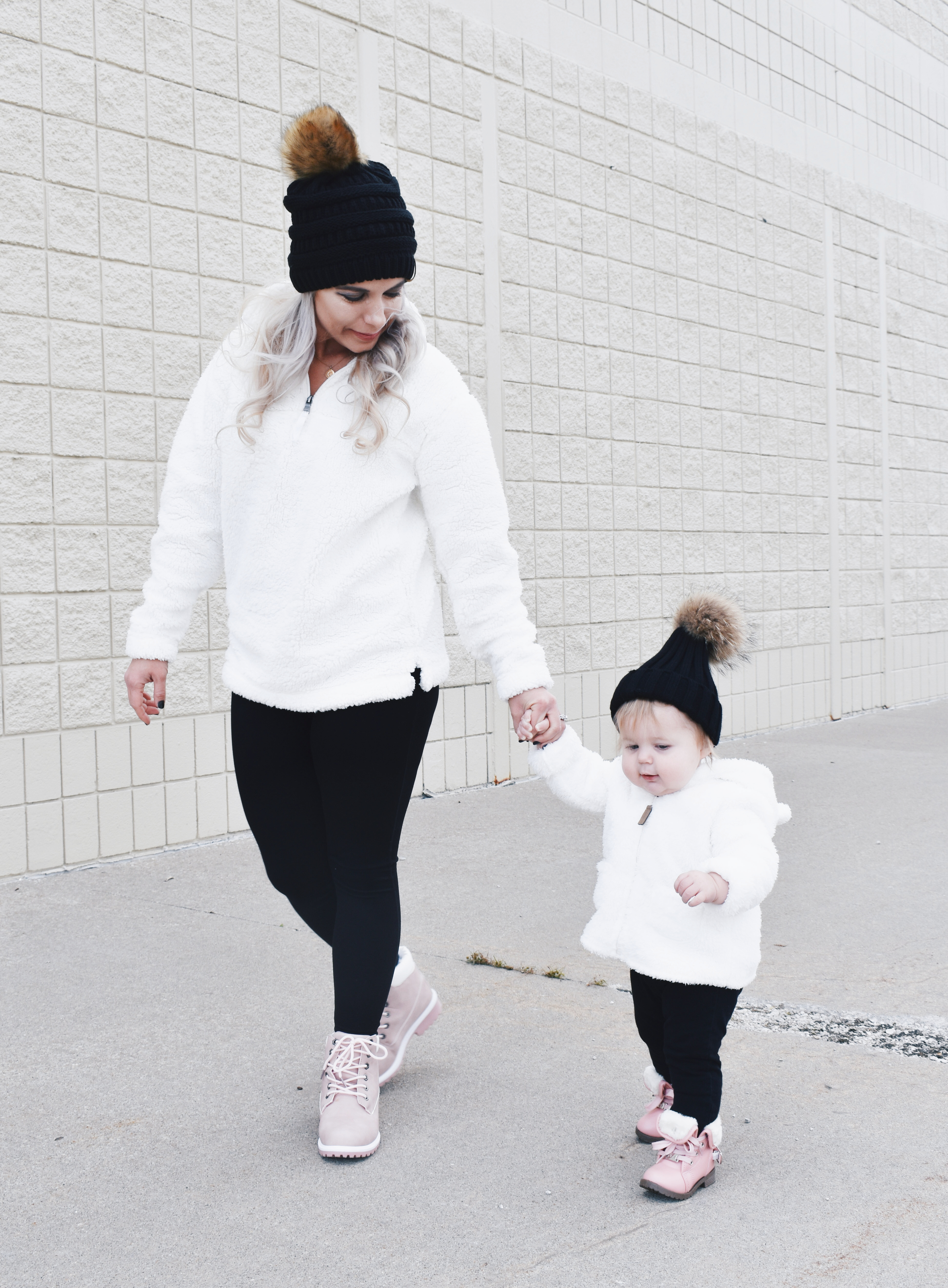 Mom and Daughter Matching Winter Outfits - Get inspo for the perfect mommy and daughter matching outfits for winter! These cozy white sherpa jackets will keep mom and baby girl warm this winter, and the matching mother daughter pink boots are to die for! Top it off with matching mommy and me pom beanie hats and you'll be the most stylish duo in town! #MommyandMe #MomandMe #LTKFamily #LTKKids