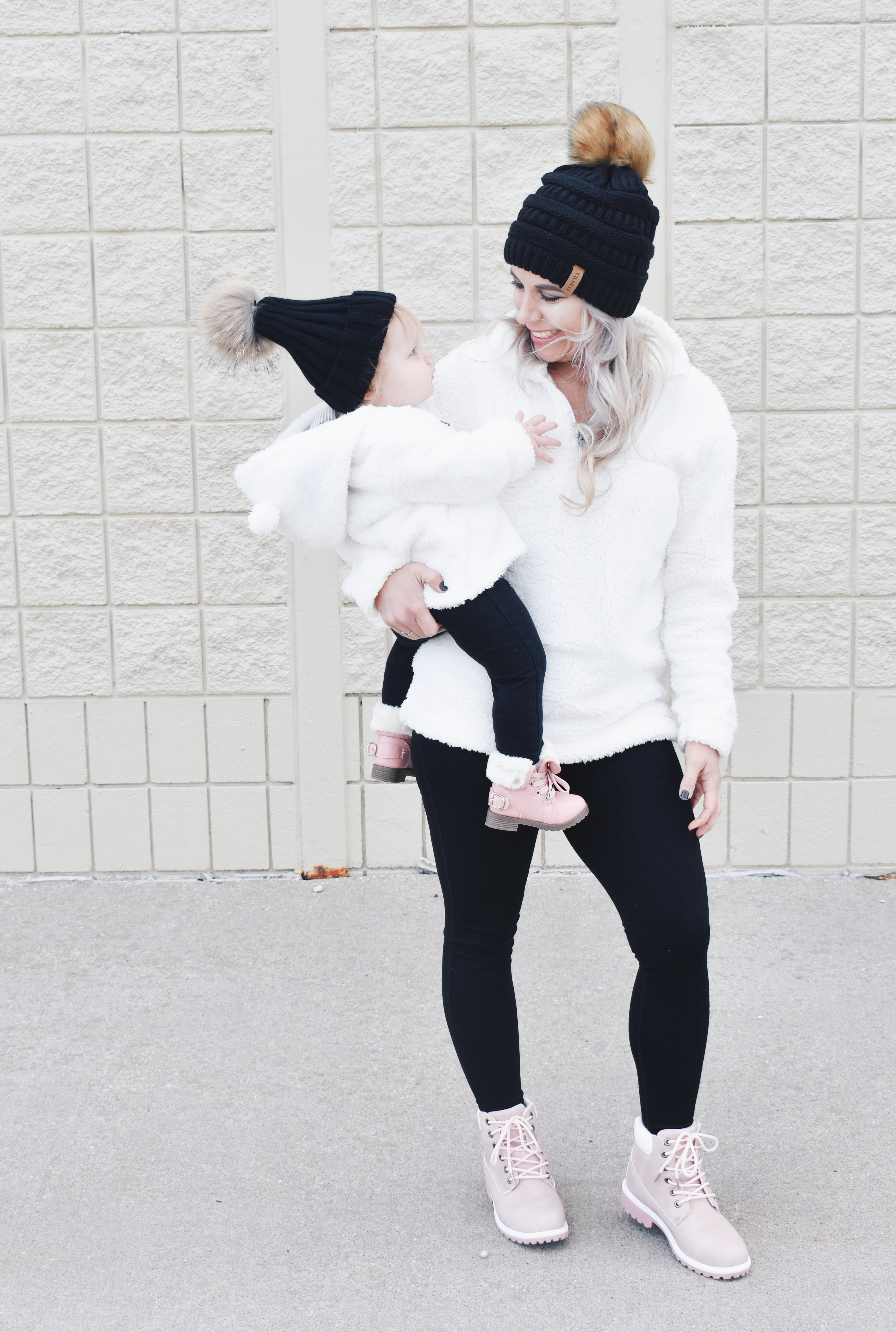 Mom and Daughter Matching Winter Outfits - Get inspo for the perfect mommy and daughter matching outfits for winter! These cozy white sherpa jackets will keep mom and baby girl warm this winter, and the matching mother daughter pink boots are to die for! Top it off with matching mommy and me pom beanie hats and you'll be the most stylish duo in town! #MommyandMe #MomandMe #LTKFamily #LTKKids