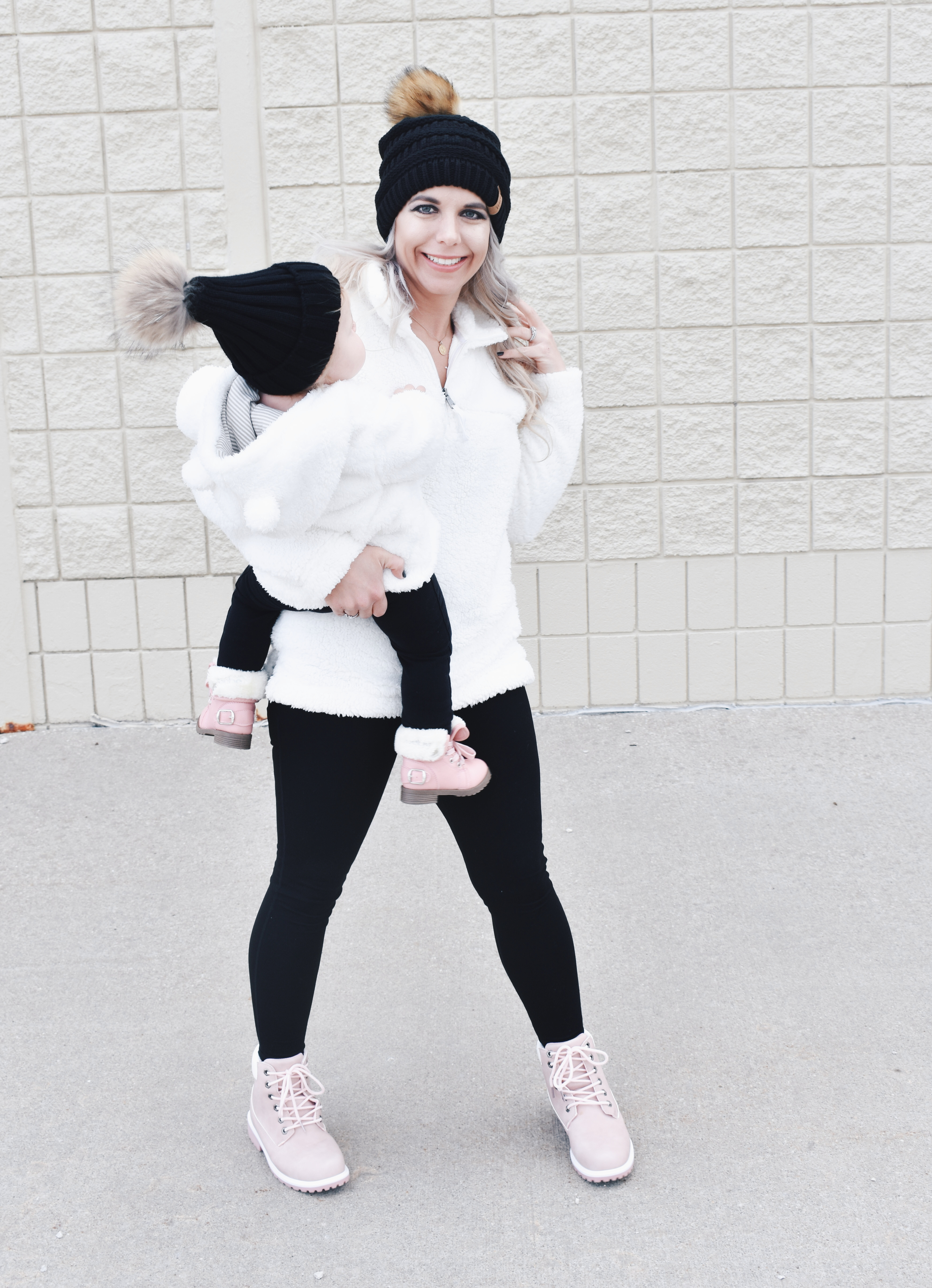 Mom and Daughter Matching Winter Outfits - Get inspo for the perfect mommy and daughter matching outfits for winter! These cozy white sherpa jackets will keep mom and baby girl warm this winter, and the matching mother daughter pink boots are to die for! Top it off with matching mommy and me pom beanie hats and you'll be the most stylish duo in town! #MommyandMe #MomandMe #LTKFamily #LTKKids