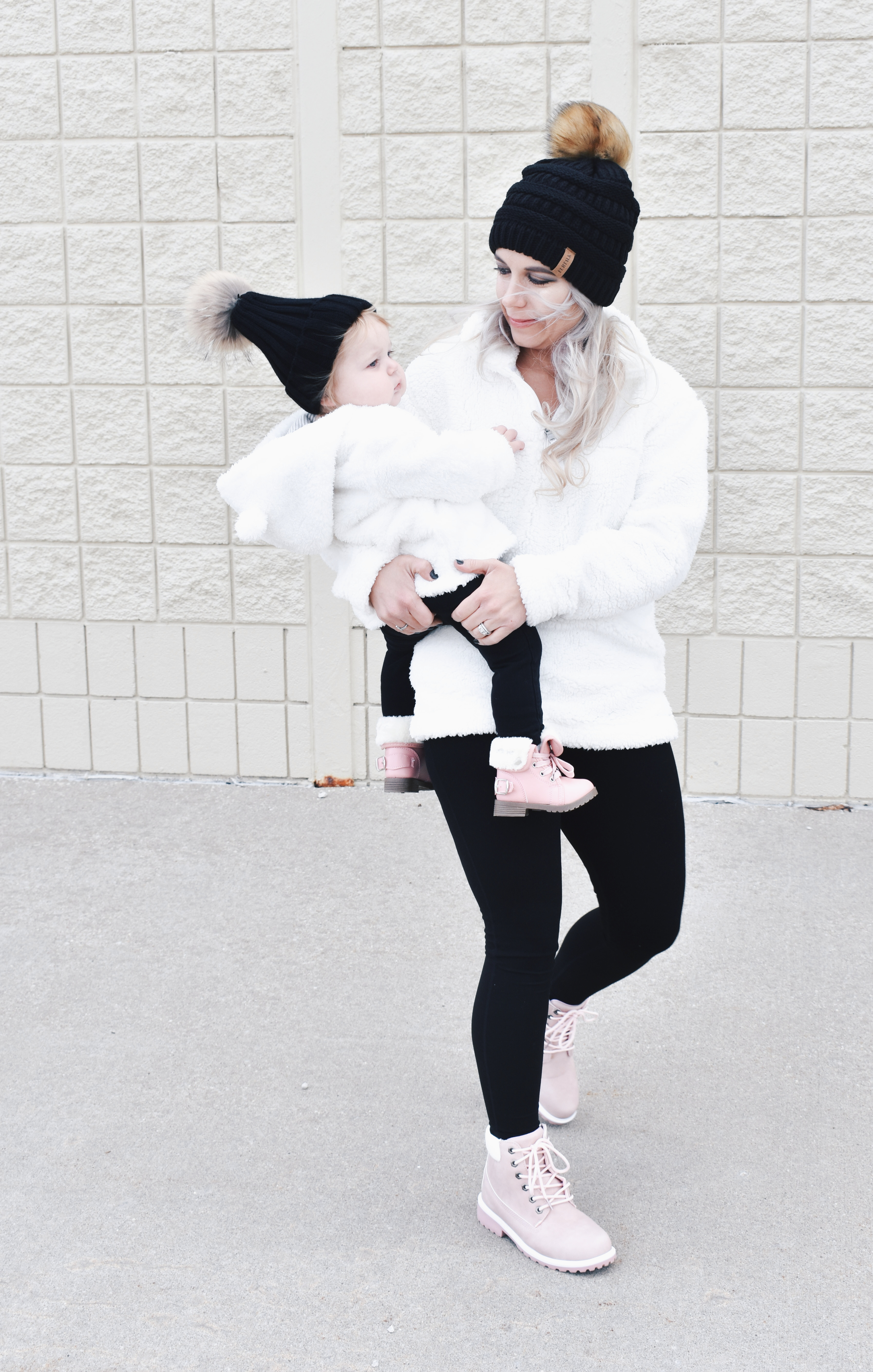 Mom and Daughter Matching Winter Outfits - Get inspo for the perfect mommy and daughter matching outfits for winter! These cozy white sherpa jackets will keep mom and baby girl warm this winter, and the matching mother daughter pink boots are to die for! Top it off with matching mommy and me pom beanie hats and you'll be the most stylish duo in town! #MommyandMe #MomandMe #LTKFamily #LTKKids