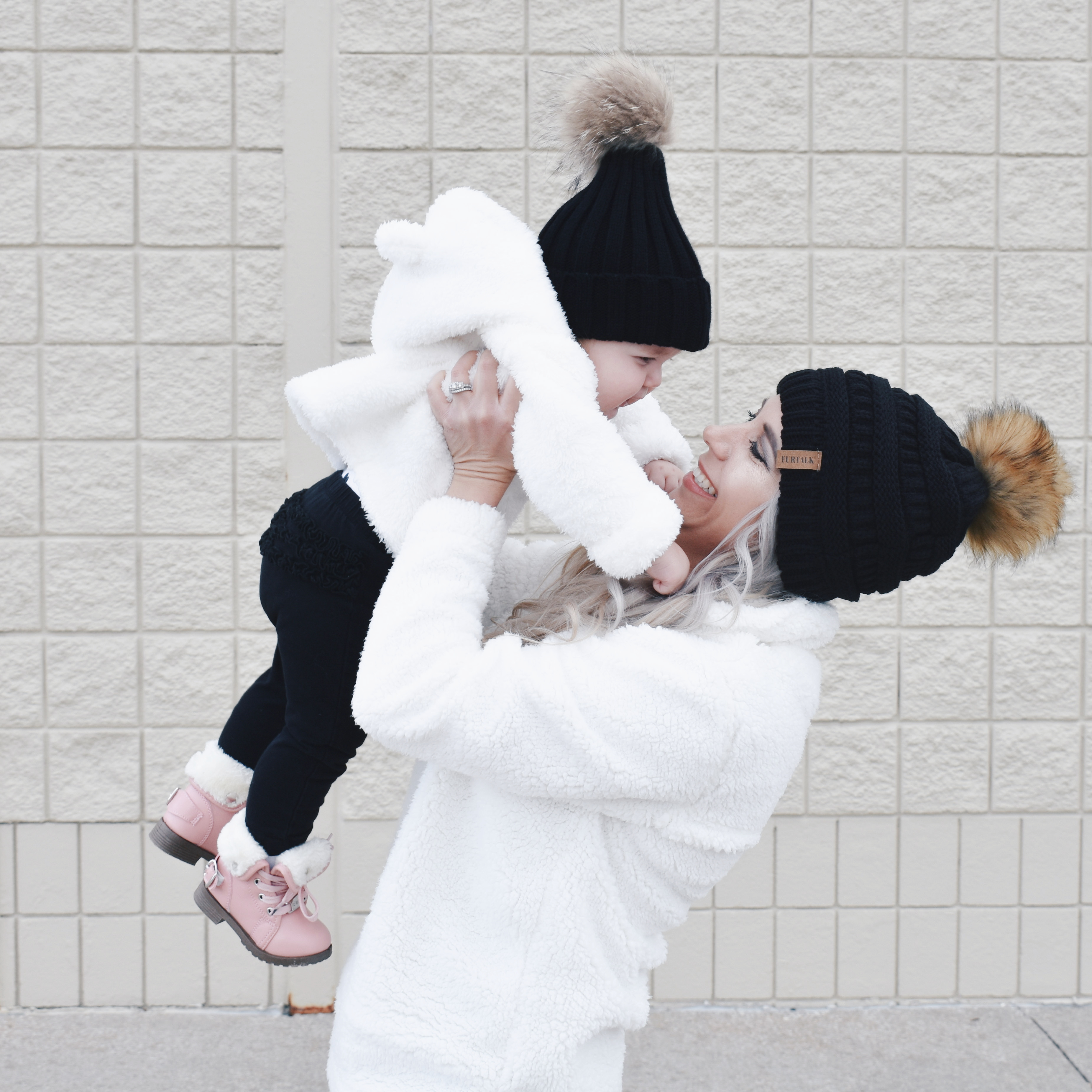 Mom and Daughter Matching Winter Outfits - Get inspo for the perfect mommy and daughter matching outfits for winter! These cozy white sherpa jackets will keep mom and baby girl warm this winter, and the matching mother daughter pink boots are to die for! Top it off with matching mommy and me pom beanie hats and you'll be the most stylish duo in town! #MommyandMe #MomandMe #LTKFamily #LTKKids