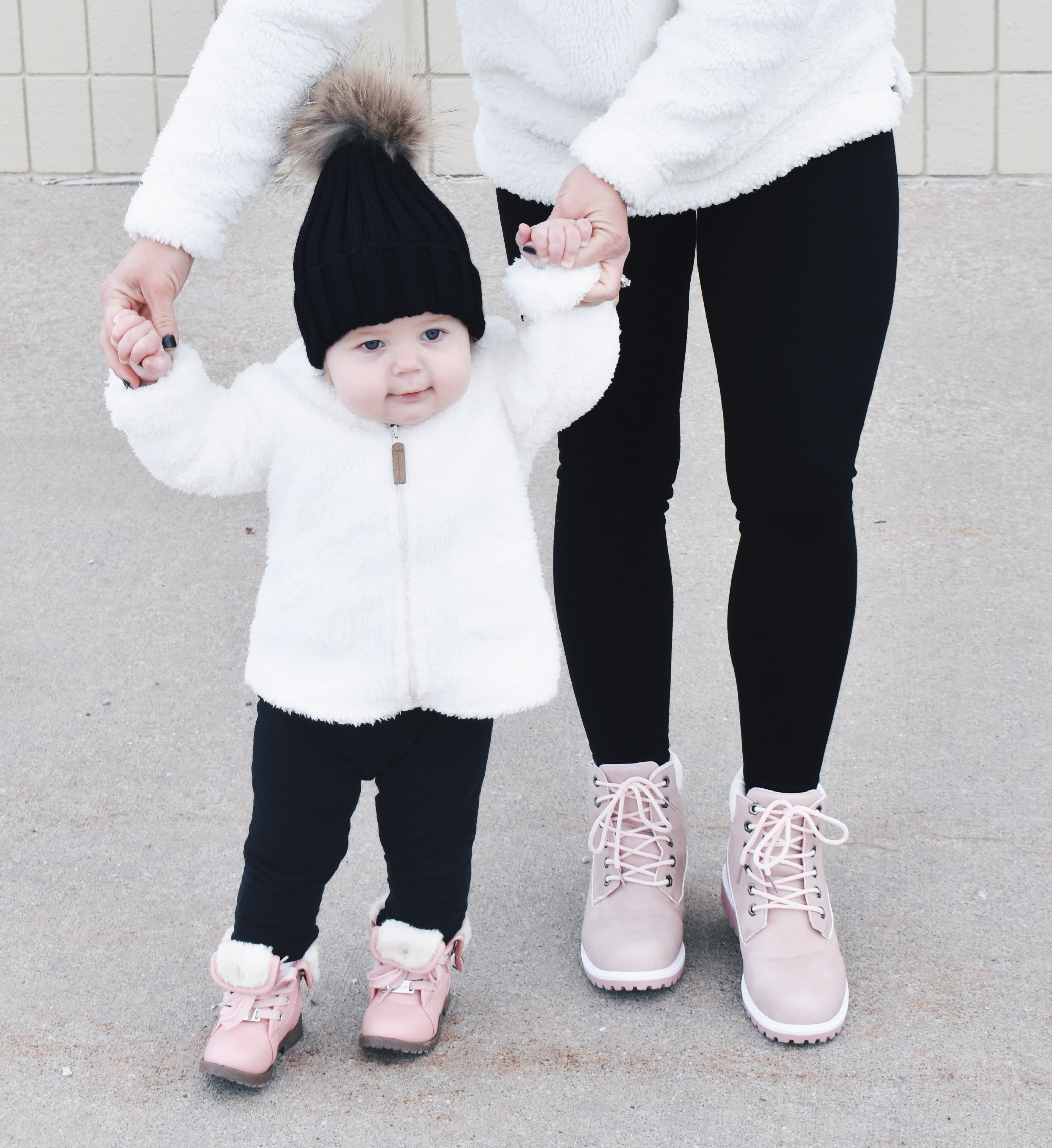 Mom and Daughter Matching Winter Outfits - Get inspo for the perfect mommy and daughter matching outfits for winter! These cozy white sherpa jackets will keep mom and baby girl warm this winter, and the matching mother daughter pink boots are to die for! Top it off with matching mommy and me pom beanie hats and you'll be the most stylish duo in town! #MommyandMe #MomandMe #LTKFamily #LTKKids