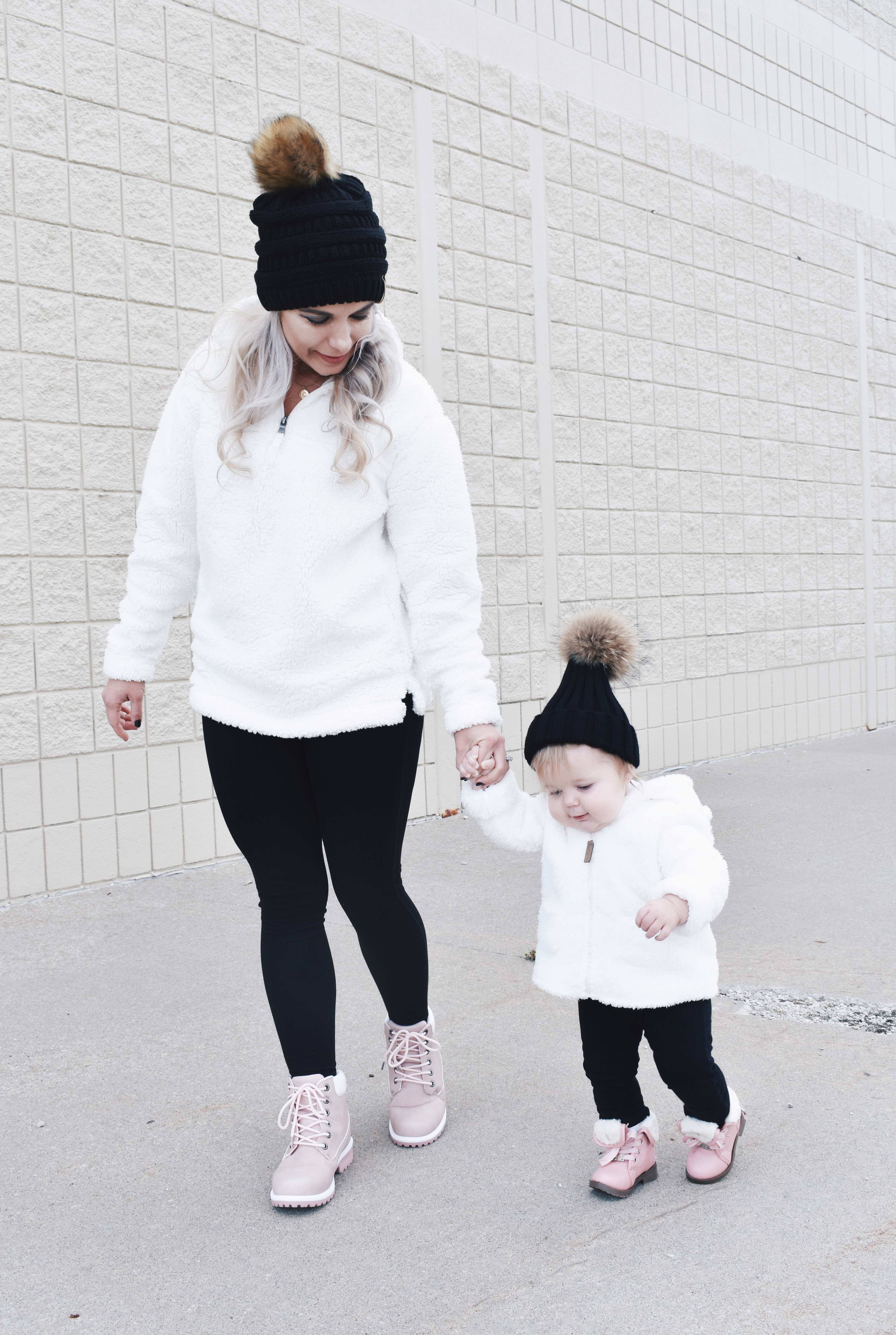 Mom and Daughter Matching Winter Outfits - Get inspo for the perfect mommy and daughter matching outfits for winter! These cozy white sherpa jackets will keep mom and baby girl warm this winter, and the matching mother daughter pink boots are to die for! Top it off with matching mommy and me pom beanie hats and you'll be the most stylish duo in town! #MommyandMe #MomandMe #LTKFamily #LTKKids