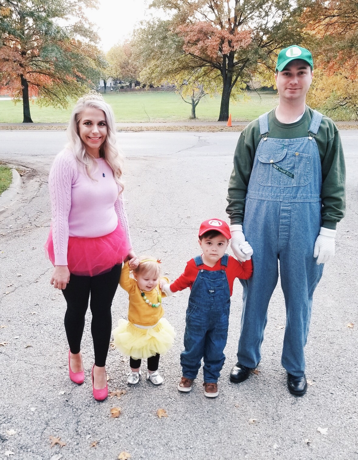 Super Mario Halloween Costumes Family - DIY Family Halloween Costume Ideas for the Super Mario-loving family! Mario Costume, Luigi Costume, Princess Peach Costume, and Princess Daisy Costume come together for a Super Mario Family Halloween Costume that will surely be a hit! #Halloween #FamilyCostumes #Mario