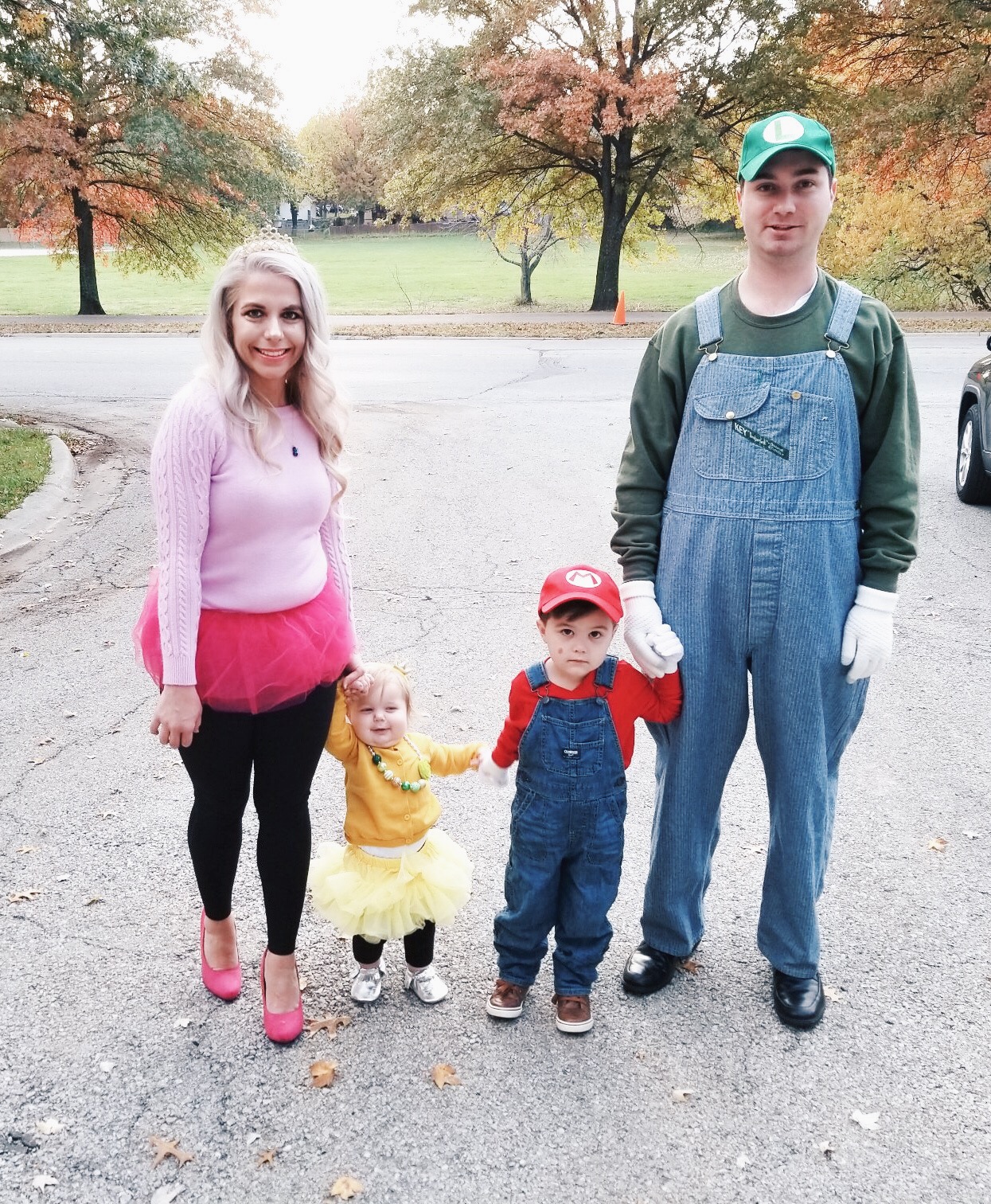 Super Mario Halloween Costumes Family - DIY Family Halloween Costume Ideas for the Super Mario-loving family! Mario Costume, Luigi Costume, Princess Peach Costume, and Princess Daisy Costume come together for a Super Mario Family Halloween Costume that will surely be a hit! #Halloween #FamilyCostumes #Mario