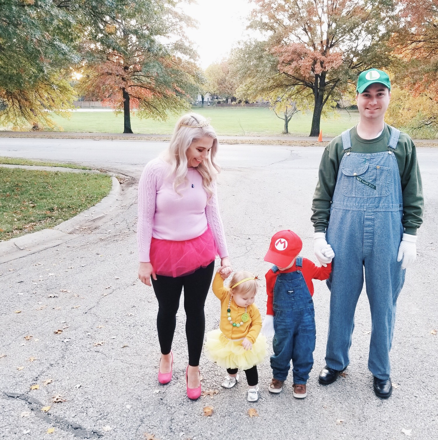 Super Mario Halloween Costumes Family - DIY Family Halloween Costume Ideas for the Super Mario-loving family! Mario Costume, Luigi Costume, Princess Peach Costume, and Princess Daisy Costume come together for a Super Mario Family Halloween Costume that will surely be a hit! #Halloween #FamilyCostumes #Mario