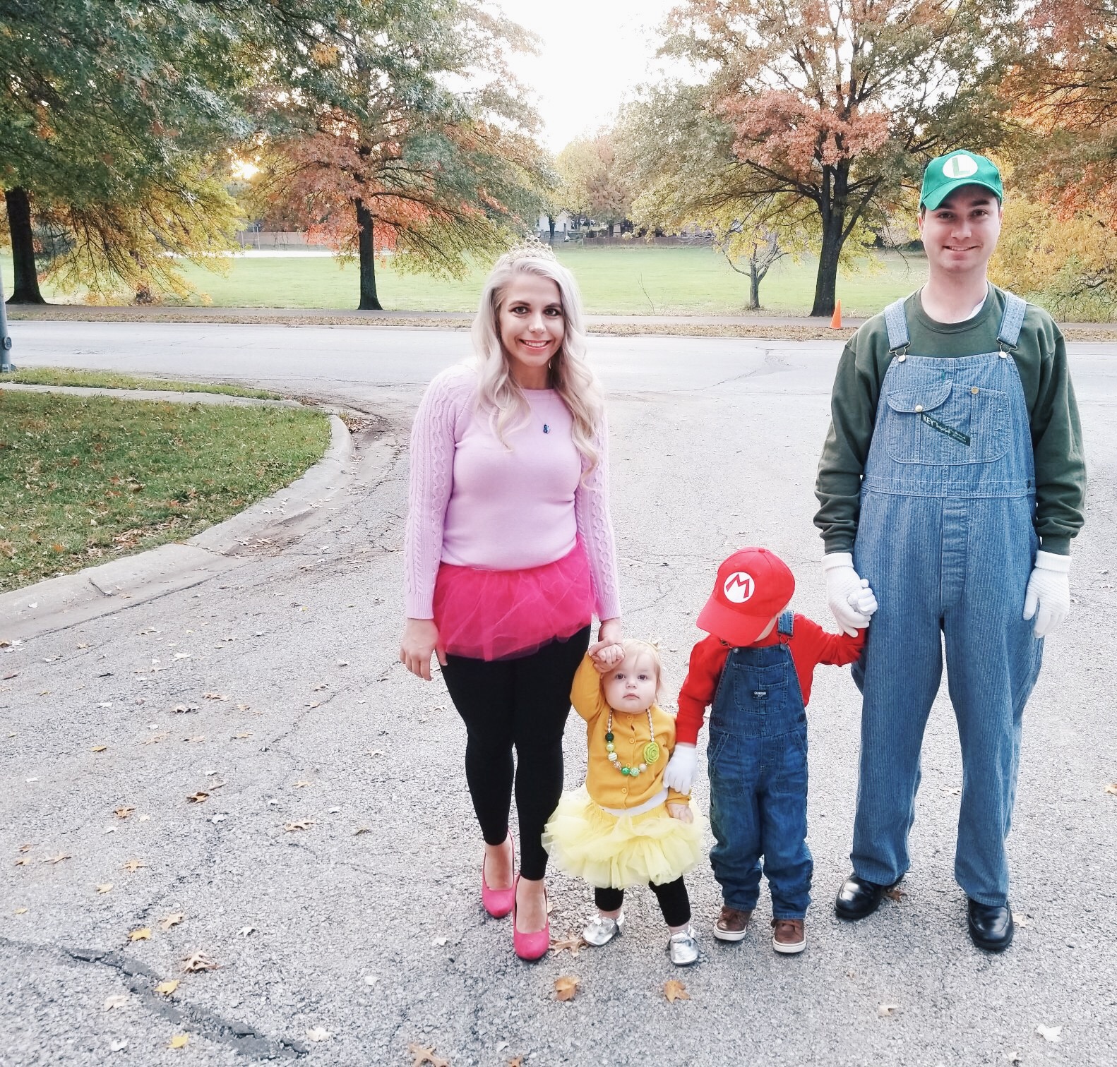 Super Mario Halloween Costumes Family - DIY Family Halloween Costume Ideas for the Super Mario-loving family! Mario Costume, Luigi Costume, Princess Peach Costume, and Princess Daisy Costume come together for a Super Mario Family Halloween Costume that will surely be a hit! #Halloween #FamilyCostumes #Mario