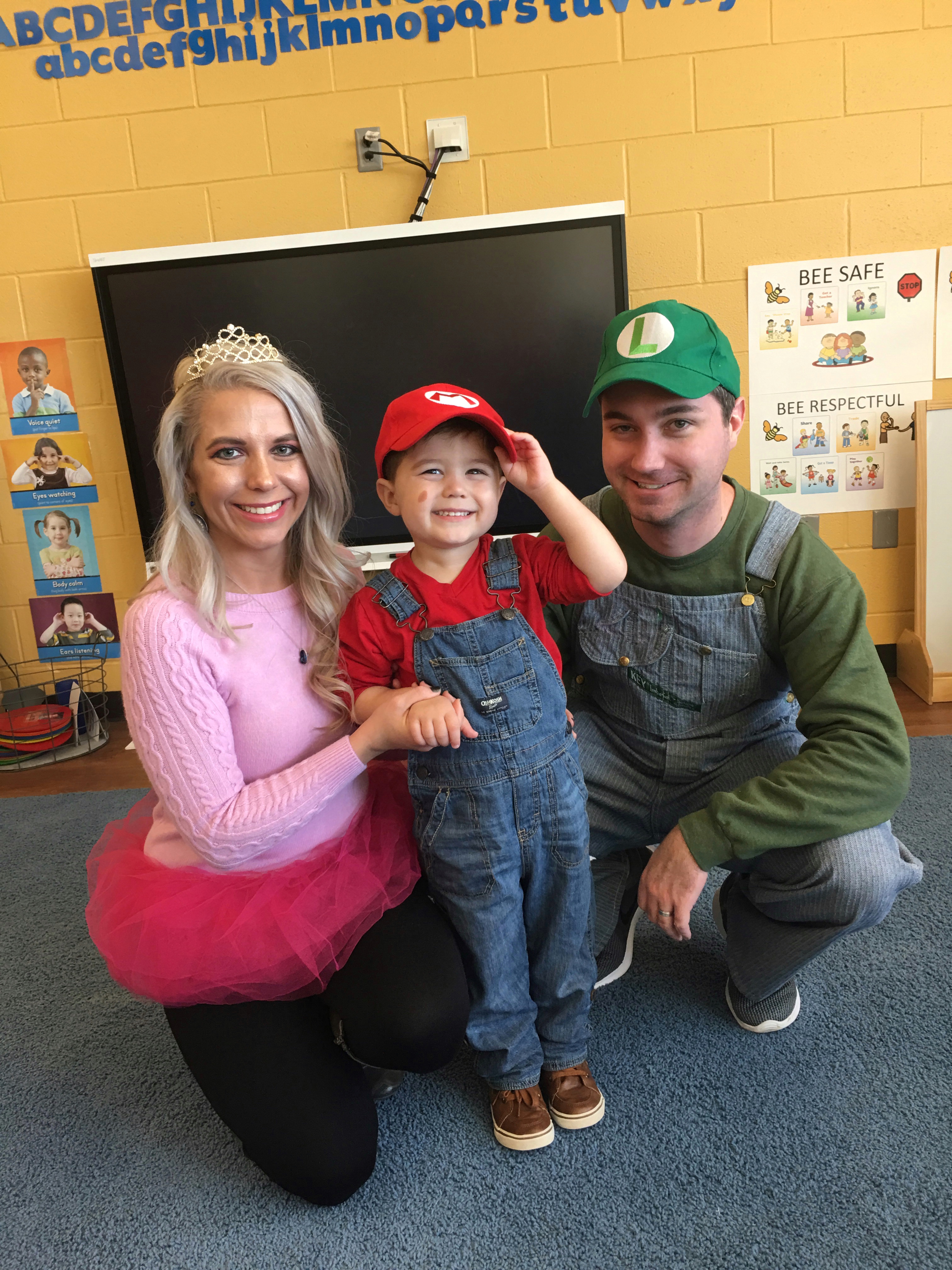 Super Mario Halloween Costumes Family - DIY Family Halloween Costume Ideas for the Super Mario-loving family! Mario Costume, Luigi Costume, Princess Peach Costume, and Princess Daisy Costume come together for a Super Mario Family Halloween Costume that will surely be a hit! #Halloween #FamilyCostumes #Mario