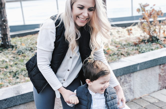 Mommy and Me Outfits - Winter Style: Fashion blogger Tricia Nibarger of COVET by tricia showcases twinning looks for the winter! Find the cutest mommy and me fashion for boy moms or girl moms with these matching puffer vests, henleys, and Hunter boots. Casual winter style for moms. #MommyandMe #MomLife #Twinning