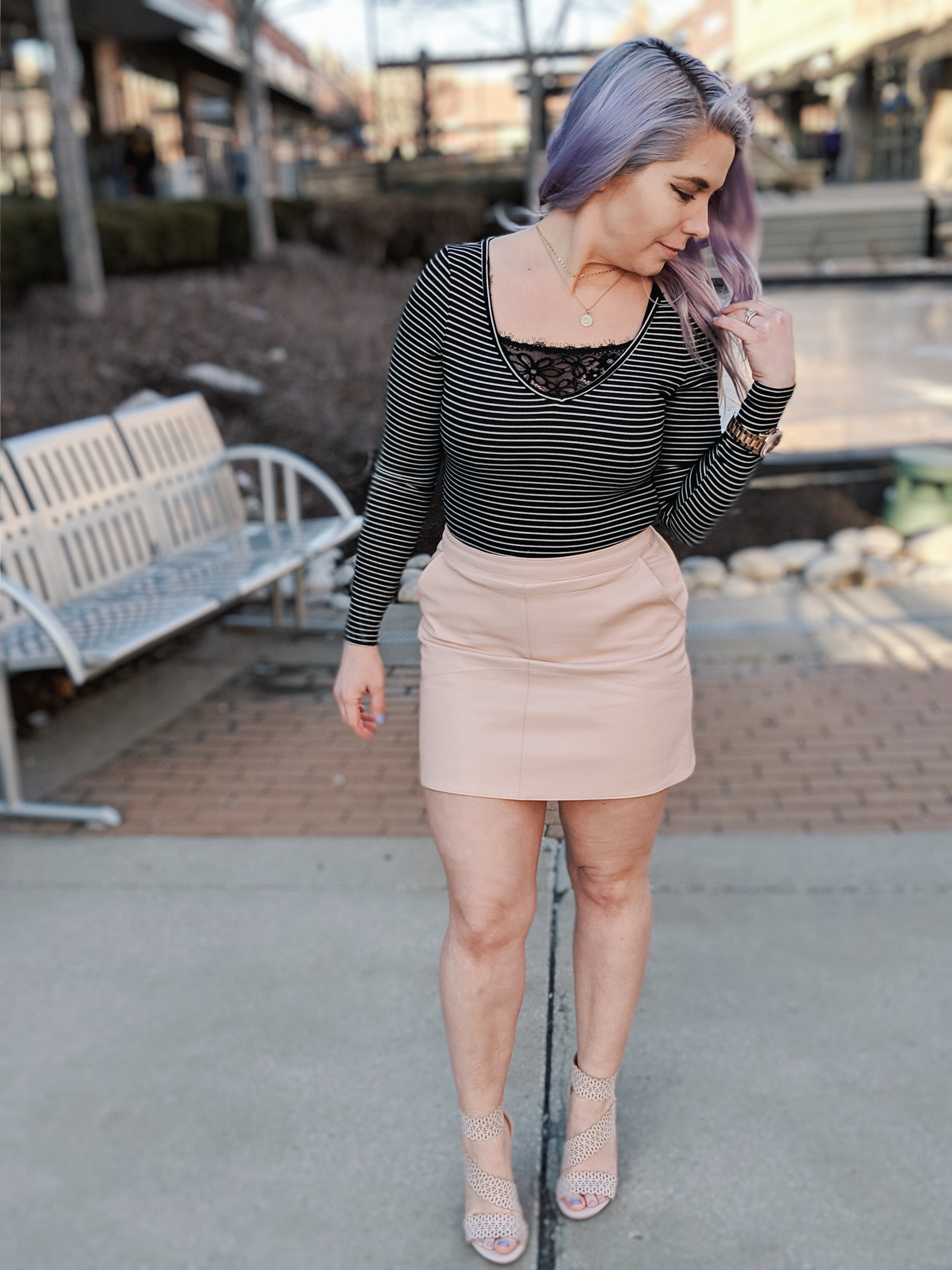 Cute Shoes for Spring 2019 - Where to find the best cute shoes for spring 2019! Kansas City fashion blogger Tricia Nibarger of COVET by tricia showcases the shoe selection at Off Broadway Shoes at Legends Outlets in Kansas City. (ad) Strappy nude sandals are paired with a pink leather mini skirt, black bodysuit, and cute bralette. #obshoes #fashion #style #fashionista #styleinspo