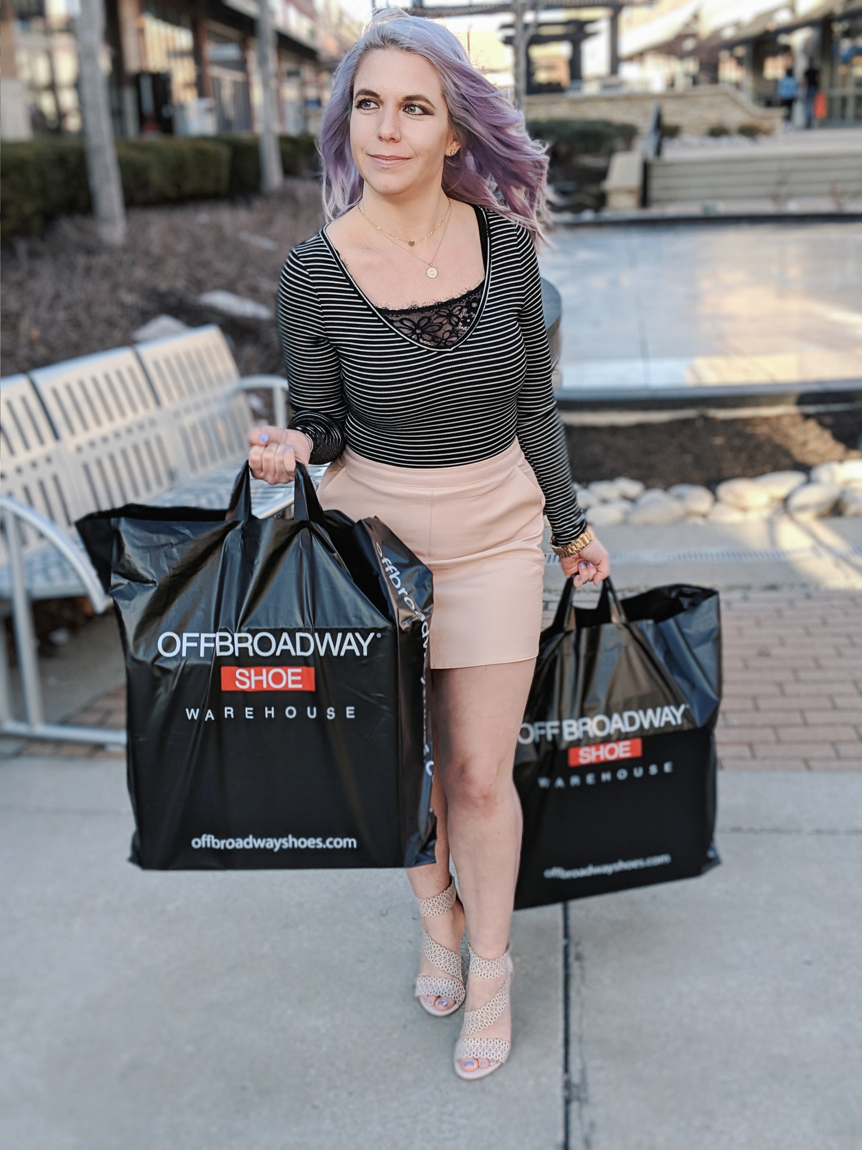 Cute Shoes for Spring 2019 - Where to find the best cute shoes for spring 2019! Kansas City fashion blogger Tricia Nibarger of COVET by tricia showcases the shoe selection at Off Broadway Shoes at Legends Outlets in Kansas City. (ad) Strappy nude sandals are paired with a pink leather mini skirt, black bodysuit, and cute bralette. #obshoes #fashion #style #fashionista #styleinspo